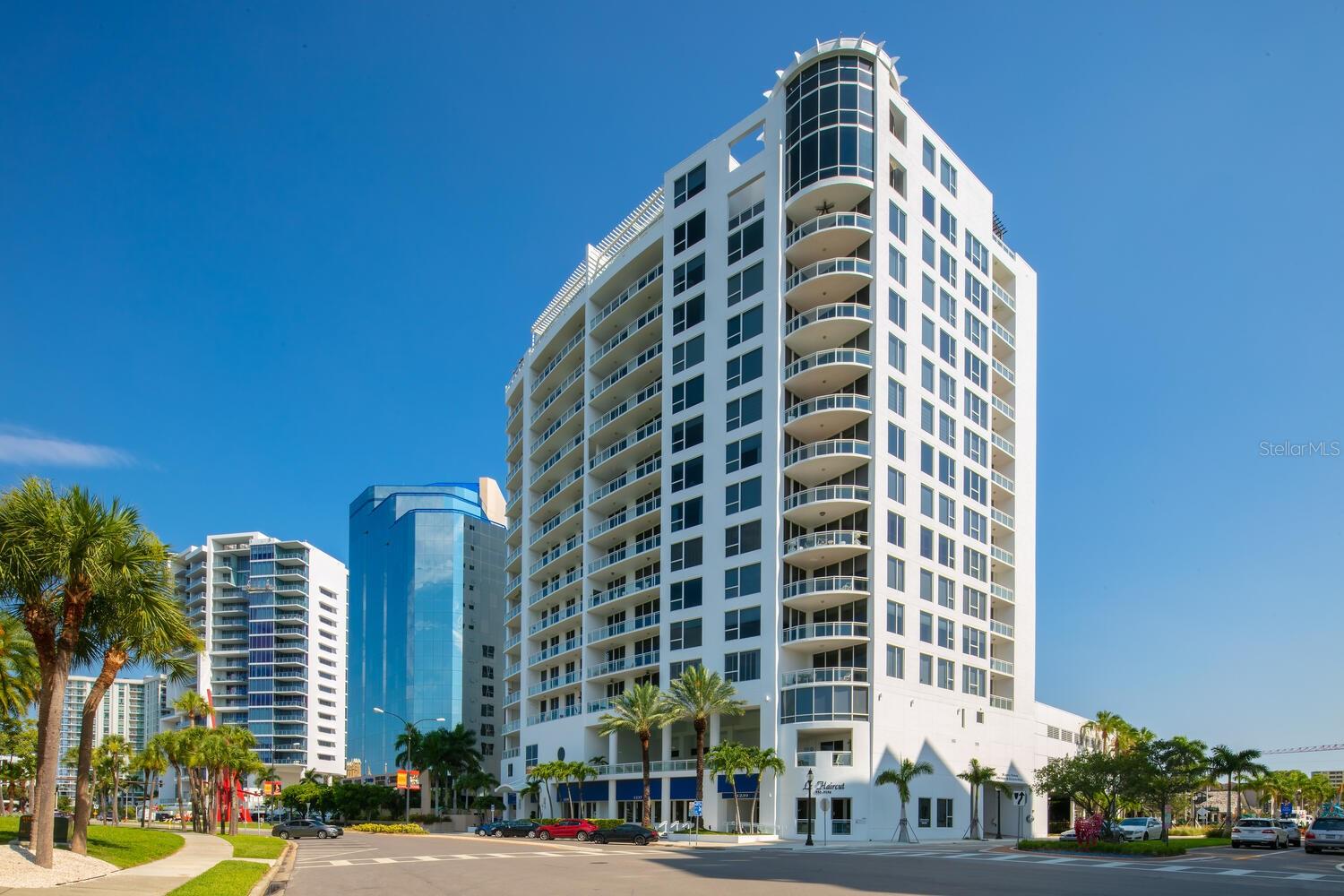 Savor sweeping views of Sarasota Bay, John Ringling Bridge, Marina Jack and Lido Key in this well-appointed 3-bedroom, 3.5-bathroom residence in the luxury 15-story Marina Tower. A vibrant downtown lifestyle awaits an easy stroll away, including abundant fine dining, art galleries, boutiques, theater district and historic opera house. The 2,635-SF condominium features a combined kitchen, living room and dining area overlooking serene azure waters, high ceilings and travertine marble flooring in most common spaces. Sliding glass doors in the main living area, en-suite guest bedroom and third bedroom open to an expansive covered patio, where you can relax and soak in the picturesque surroundings. The kitchen, completing remodeled in 2017, features an island, electric cooktop, oven/microwave, built-in double wine cooler, custom cabinets and stone countertops. There is also a small den/office. In addition to its proximity to everything the downtown offers, the condominium is just a short drive over the Ringling Bridge to bustling St. Armands Circle and Lido Key’s pristine white-sand beach on the Gulf of Mexico. Marina Tower is a highly desirable building with an array of resort-style amenities, including a heated pool and spa, fitness center, private guest suite, community room with catering kitchen and 24-hour security. The unit includes two deeded parking spaces in a secure under-building garage. Don’t miss this rare opportunity to make residence your own.