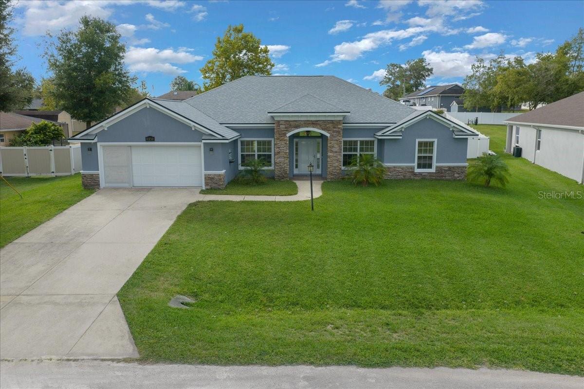 Stunning 4-Bedroom, 3-Bath Home on Half an Acre — No HOA, No CDD! Seller is offering $15,000 toward closing costs!
Welcome to this beautifully upgraded Triple Crown Homes “Gabriel” floor plan, offering 2,374 sq. ft. of elegant living on a private cul-de-sac street with no front neighbors and no HOA or CDD — the perfect blend of privacy, comfort, and freedom.
Step inside and be greeted by soaring 12-ft ceilings, custom crown molding, and architectural details that immediately draw your eyes to the serene backyard and screened lanai through the triple sliding glass doors. The open design features a formal dining room, family room, breakfast nook, and a spacious living room perfect for entertaining.
The kitchen is a chef’s dream — complete with stainless steel appliances, Corian countertops, tile flooring, and ample cabinetry. Throughout the home, you’ll find luxury laminate vinyl plank flooring installed in 2023, while the kitchen and baths feature elegant tile for a refined touch.
Major upgrades include a new roof (2023), new well (2023), and fresh interior paint, making this home truly move-in ready.
Originally built as the builder’s model home, the garage floor was elevated to match the main living area, creating the perfect opportunity to easily convert it into an air-conditioned gym, home theater, or game room/man cave.
Set on a spacious half-acre lot, there’s plenty of room to add a pool, boat, RV, or trailer — or simply enjoy the wide-open yard as your personal oasis. Conveniently located in one of Ocala’s fastest-growing areas, you’re just minutes from schools, supermarkets, shopping, and restaurants.
Don’t miss this rare opportunity to own a beautifully maintained, model-quality home in a peaceful setting with all the modern upgrades and no restrictions. Schedule your private tour today — your dream home awaits!
Easy to show on Lockbox