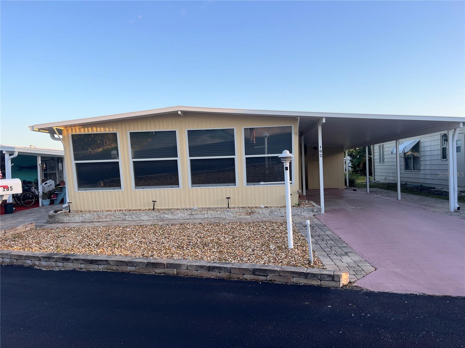 Move in ready 2bed/2bath Bungalow at the Beach! This super cute home may be small but has a very nice floor plan that makes it seem larger than the square footage. The kitchen and bathrooms have been updated, newer mini blinds and vinyl flooring throughout. Windows replaced in 2013, A/C and Roof replaced in 2017. This super cute home has a large 10x20 enclosed front porch that adds quite a bit of living space to the home, just open the windows and enjoy the beach breeze right from your front porch! Easy maintenance landscaping, a long driveway with room for 2 cars, pavers to park your golf cart. This home comes partially furnished and all appliances stay! Right behind you is one of the largest common area garden parks, perfect spot to walk your pets or if you like to garden. Surfside Estates, an active 55+ Manufactured Home Community that is nestled between the Atlantic Ocean and the Intracoastal Waterway. When you purchase your home in Surfside Estates you own a share of this beautiful beachside community, there is no lot rent. The monthly maintenance fee is $180/month, includes wi-fi, internet, cable, lawn maintenance, management and use of all the facilities. There is an inground heated/cooled pool, fitness room, library, shuffleboard court and rooftop deck. The Social Club offers many activities to get involved as much or as little as you like. Friday night bingo, men's and lady's cards, pool tables and large screen TV for all your sporting events. Exercise classes and water aerobics. Walk to the beach across the street or ride your bike or golf cart to one of the 2 docks to enjoy fishing or just relax and enjoy the sunsets and the boats and dolphins go by. There is kayak storage, a BBQ Pit and gazebo with a view of the Intracoastal. The quaint neighboring town of Flagler Beach is just a few minutes down the road, where you will find a variety of shops and restaurants to choose from. Just over the bridge you will find shopping, restaurants, hospitals and doctors. What are you waiting for? Isn't it time to start enjoying the beach life! This home is available for quick cash closing.