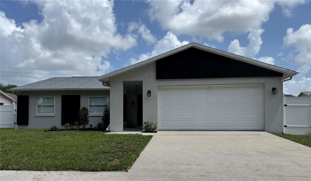 Photo of 8625 Woodcrest Drive, Port Richey, FL 34668 (MLS # W7885379)