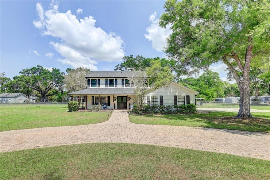 Highly sought after Buckhorn Gulf Course Area: Experience the perfect blend of country charm and modern convenience with this exceptional POOL HOME situated on 1.76 PRIVATE ACRES —just minutes from city life, shopping, and dining. This expansive 5-BEDROOM, 4 FULL BATH, and 2 HALF BATH residence offers over 5,000 square feet under roof, thoughtfully designed for both comfort and entertaining. A grand entrance welcomes you as you pull into the CUSTOM PAVED CIRCLE DRIVE. The paved side walk leads you onto the huge WRAP-AROUND FRONT PORCH and sweeps you through CUSTOM DOUBLE DOORS into a stunning foyer, featuring a PRIVATE OFFICE to the left and a sleek modern staircase to the right. At the heart of the home is a massive, open-concept GOURMET KITCHEN equipped with GRANITE COUNTERTOPS throughout, a large BAR, DUAL SINKS, TWO WINE FRIDGES, GAS RANGE/OVEN, and an OVERSIZED refrigerator—perfect for hosting and everyday living. The kitchen flows seamlessly into the great room, living room, and formal dining area, where a WOOD-BURNING FIREPLACE adds warmth and elegance. A standout feature is the unique IN-LAW SUITE on the main level, offering ultimate privacy and luxury with DUAL TOILETS, DUAL SINKS, a spacious DUAL WALK-IN SHOWER with tile finishes, and TWO CUSTOM WALK-IN CLOSETS, all complemented by abundant natural light. Upstairs, you’ll find TWO PRIMARY SUITES. PRIMARY SUITE ONE is the luxurious main suite with a SPA-LIKE BATHROOM featuring a walk-in CUSTOM TILE SHOWER, modern TUB, DUAL SINKS set in GRANITE with beautiful tile finishes throughout. Step out onto your PRIVATE SCREENED BALCONY overlooking the pool, and fully fenced backyard. PRIMARY SUITE TWO is almost equally enchanting with TWO WALK-IN CLOSETS, a THIRD WALK-IN CLOSET OR OFFICE, LINEN CLOSET & large bedroom. There are two additional guest bedrooms with WALK-IN CLOSETS and a shared bath with shower/tub combo and DUEL SINKS set in GRANITE. All upstairs rooms feature energy-efficient THERMAL TRIPLE-PANE WELDED WINDOWS. Outdoor living is just as impressive, with a SCREENED LANAI, leading to a PAVED PATIO, SPARKLING POOL with a private pool 1/2 bath, and FIRE PIT—ideal for relaxing or entertaining. The expansive FULLY FENCED BACK YARD offers plenty of space for pets, gatherings, or outdoor activities. Storage shed conveys for extra storage space and the propane gas tank is under ground. Additional highlights include a private well, WHOLE HOUSE GENERATOR and septic system, along with numerous recent upgrades:
***2024: New shingle roof, New well pump, Pressure tank, Whole House water softener, New fence and New control panel for the stove****2025: Custom Apex Energy Solutions Windows thermal triple-pane welded frame (all upstairs windows replaced), New AC compressor and controller, Custom Apex Energy Solutions solid core front double doors. This one-of-a-kind property delivers space, privacy, and upscale features—country living at its finest with city conveniences. 30 minutes to DOWN TOWN TAMPA, 37 minutes to TAMPA INTERNATIONAL AIRPORT. THIS IS A MUST SEE!!!
