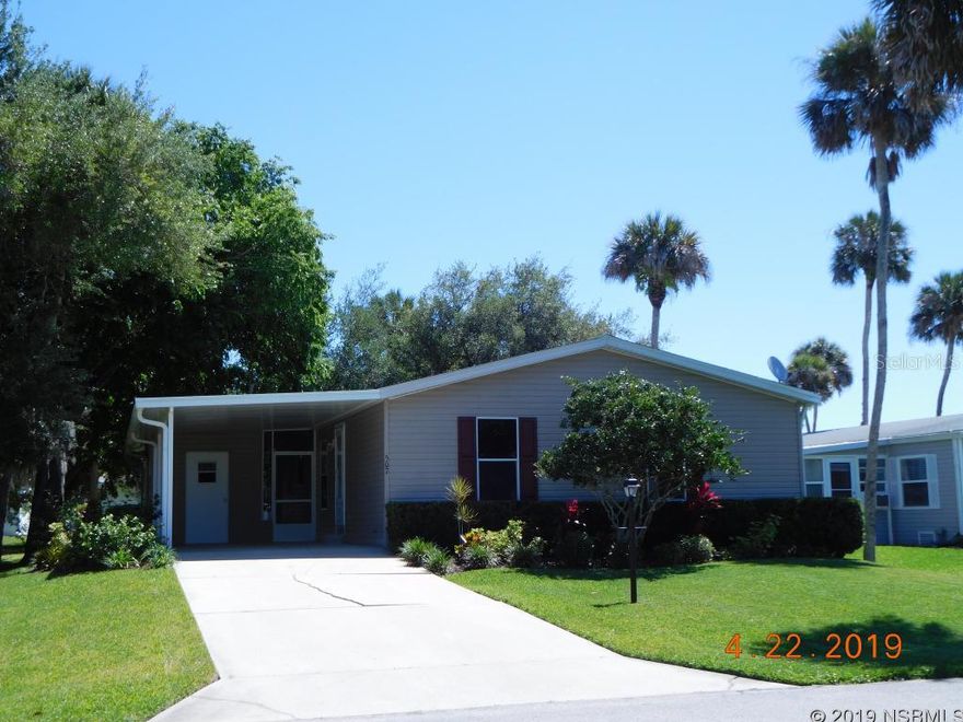 Lighthouse Cove is a beautiful gated community located in Oak Hill,  where fishing in the Indian River is at it's finest. This riverfront community features absolutely gorgeous unspoiled nature, large clubhouse with kitchen and small fitness room, plus has weekly activities and events. Heated swimming pool, tennis, pickleball and shuffleboard courts and waterfront picnic pavilions. Golf carts are a means of transportation in this community! Plus enjoy watching the sun rise each morning from the community dock, launch your boat from the community boat ramp! 2BR 2BA manufactured home, 1,269 sq feet, split bedroom floorplan. Walk in closets. Light and bright kitchen with lots of counter space and storage cabinets, breakfast nook, spacious living room, plus inside laundry room with washer dryer hook ups. Deep carport, nice sized 12x12 screened porch plus a workshop/storage with built in shelving and electric. Beautifully shaded back and side yard. Nicely landscaped. Pets restricted.