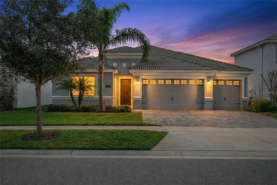 Welcome to 1488 Olympic Club Boulevard, a beautifully cared-for 4-bedroom, 3-bath residence with a 3-car garage, built in 2019 and located inside the gated ChampionsGate Country Club community. This home offers a modern layout, quality finishes, and a comfortable flow that makes it ideal for both everyday living and hosting guests.

Inside, the open floor plan connects the main living areas seamlessly, creating a bright and inviting space. The kitchen is centrally positioned and features stainless steel appliances, quartz countertops, generous cabinet storage, and a large island that works perfectly for meal prep, casual dining, or entertaining. Neutral finishes and thoughtful details throughout the home create a clean, move-in-ready feel.

The primary bedroom is set privately at the rear of the home and includes a spacious walk-in closet, dual sinks, and a large walk-in shower. Additional bedrooms offer flexibility for guests, family members, or a home office.

Recent features and upgrades include interior and exterior paint, updated lighting, ceiling fans, a whole-home water filtration system, reverse-osmosis drinking water system in the kitchen, impact windows, window treatments with blackout options in select rooms, and energy-efficient systems throughout.

Step outside to a covered patio and backyard space with peaceful garden views—perfect for relaxing, outdoor dining, or enjoying the Florida weather year-round.

Located in ChampionsGate Country Club, residents have access to resort-style amenities including golf, tennis, pools, fitness centers, dining options, and multiple clubhouse facilities. The HOA covers lawn care, security, cable, internet, and additional community services, creating a convenient, low-maintenance lifestyle. A well-maintained, newer construction home in a sought-after gated golf community—ready for its next owner to enjoy.