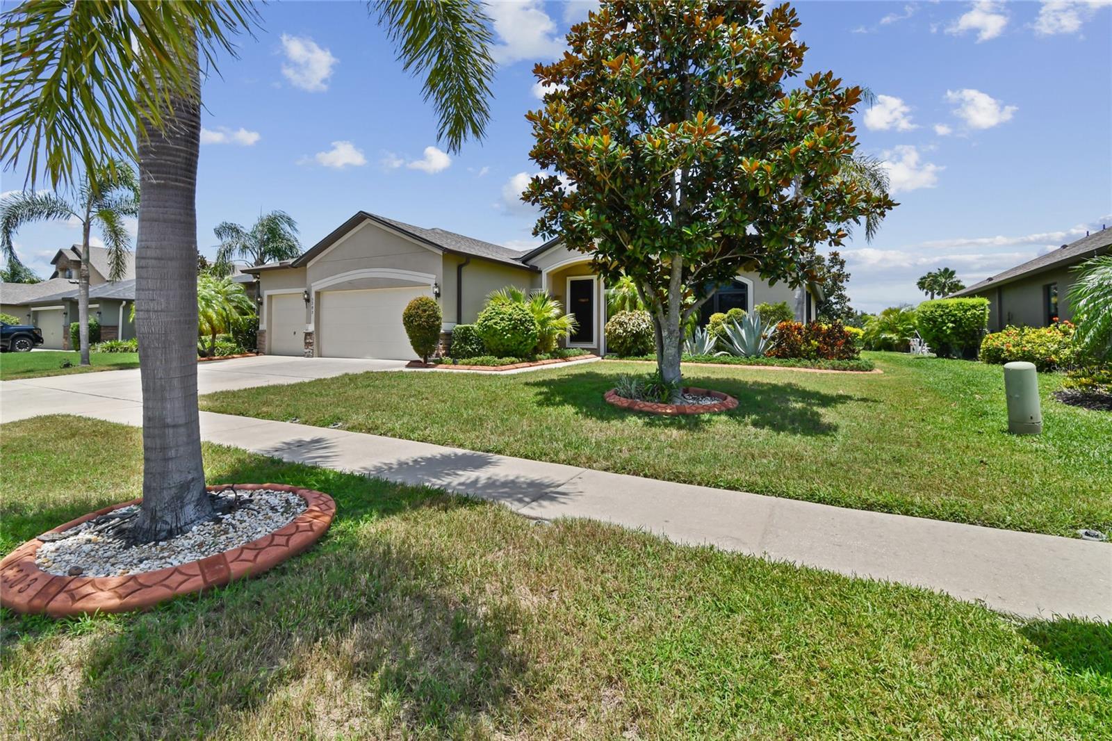 Come and enjoy living in this outstanding location
Walking into 2,394 square feet of thoughtfully designed living space where every detail has been carefully considered. This home in Harbour Isles combines the warmth of rich hardwood floors with the practicality of an open floor plan, creating spaces that flow naturally from daily routines to special occasions.
The heart of the home centers around a kitchen built for both quick weekday meals and weekend entertaining. Granite countertops provide ample workspace, while 42-inch cabinets and a walk-in pantry keep everything organized. Stainless steel appliances handle everything from morning coffee to holiday feasts.
Privacy comes naturally with the thoughtful split-bedroom layout. The primary suite feels like a personal retreat, complete with dual walk-in closets and a spa-inspired bathroom featuring both a soaking tub and separate shower. Three additional bedrooms adapt to your changing needs—whether that's accommodating family, creating a home gym, or setting up the perfect workspace in the dedicated office.
The screened lanai extends your living space outdoors, where pond views create a peaceful backdrop for morning coffee or evening conversations. Hurricane shutters provide peace of mind during storm season, while the three-car garage offers plenty of storage and protection for your vehicles.
Harbour Isles adds another layer of convenience with its walking trails, community pool, clubhouse, and fitness center. The fishing docks and basketball court mean recreation is always just steps away. With excellent schools nearby and easy access to shopping and dining, you're connected to everything that matters while enjoying the tranquility of your own private retreat.
Recent updates include a new water heater, updated lighting fixtures, and a whole-home water filtration system—meaning you can simply move in and start living.