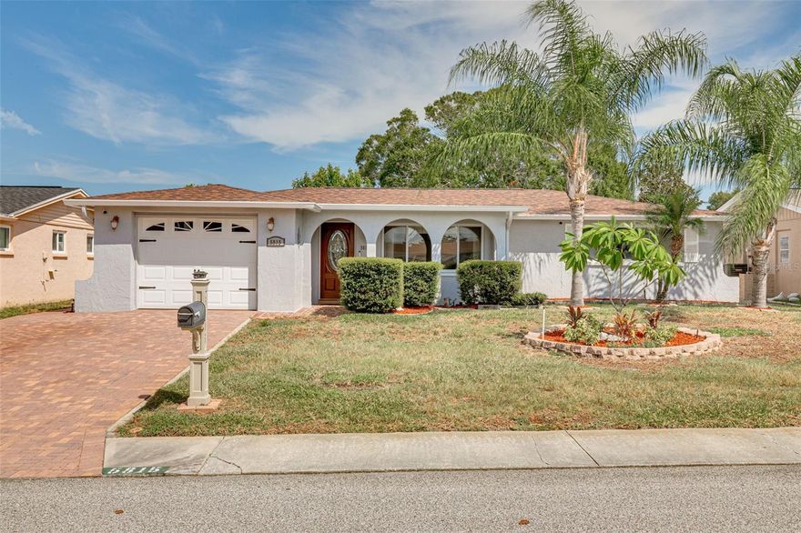 This 3-bedroom, 2.5-bathroom residence is the epitome of comfort and style. From the moment you arrive, you'll be charmed by its adorable curb appeal and the inviting paver driveway that enhances its overall visual appeal. Step inside, and you'll be greeted by a spacious living room that sets the stage for this delightful home. The real heart of this property lies in its tastefully updated kitchen, where modern elegance meets functionality. With sleek granite countertops, stainless steel refrigerator, microwave and range, with contemporary finishes, this kitchen is a chef's dream, making cooking and entertaining an absolute pleasure. The kitchen seamlessly flows into an additional living space, providing room for both relaxation and socializing. When you're ready to enjoy the Florida sunshine, simply step through the glass slider into the Florida room, which opens up to the backyard. Convenience abounds in this home, with a half bathroom conveniently located off the kitchen and easy access to the garage. You'll appreciate the beautiful tile floors that grace the main living areas, while the bedrooms feature laminate flooring for added warmth and comfort. Updated windows further enhance energy efficiency and aesthetics, contributing to the overall appeal of the home. Investment peace of mind is assured knowing that the roof was replaced just 3 years ago, sparing you the inconvenience and cost. The HVAC system, a vital component of your home's comfort, is 7 years old. This property offers generous living spaces, perfect for relaxation and entertainment. Whether you're a first-time homebuyer or looking to elevate your living experience, this property effortlessly combines comfort, convenience, and style. Don't miss your opportunity to make this house your cherished home.