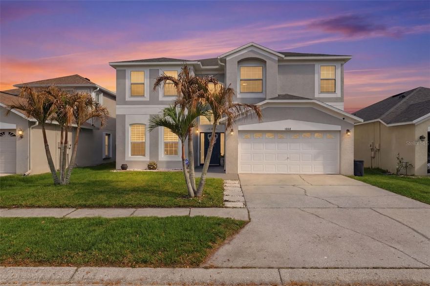 This 5-bedroom, 3-bath home with a 2-car garage offers a spacious layout designed for comfortable living, complemented by serene water views that capture the essence of Florida living. As you enter the bright foyer, you’re drawn in by the high ceilings and immediately notice the double glass doors with built-in blinds between the panes to the left, leading to a beautiful and spacious office with two large windows and dark wood plank flooring. From the office, a set of French doors leads into a versatile flex space currently used as a home gym. Positioned between the office and kitchen, this room serves as a convenient corridor connecting the two areas while a large window fills the space with natural light, creating a bright and inviting atmosphere. Moving forward from the foyer, you pass the staircase leading to the second floor, before walking through the arched opening into the expansive living room, where wide sliding glass doors perfectly frame peaceful water views beyond the backyard. To the left is the kitchen and dining area, which features multiple large windows and a pass-through opening above the kitchen sink that can be used as a breakfast bar while also connecting the space to the living room. The kitchen features granite countertops, dual sink, all stainless steel appliances, a tasteful white tiled backsplash, and solid wood cabinetry. On the opposite side of the main living area, sits a large bedroom with an expansive walk-in closet, adjacent to a bathroom that has direct access to the pool area, and includes an all white single vanity with storage and framed mirror, and a glass-enclosed step-in shower. Nearby, the laundry room provides built-in shelving for storage. The top of stairs opens to a flex space with wood-look luxury vinyl flooring, an open-to-below view overlooking the foyer and multiple windows. Nearby, the primary bedroom includes luxury vinyl flooring, extra space for a sitting area, reading nook, or coffee bar, several windows, walk-in closet, and double doors leading to the ensuite bathroom. The ensuite bathroom features a corner soaking tub positioned beneath a window, double vanities with wood framed mirrors and granite countertops and a step-in shower with marble-like tile, frameless glass partition and rainfall-style shower head. The remaining bedrooms have matching flooring, windows bringing in natural light, and two with built-in closets. The second-floor guest bathroom has tile flooring, a window, granite countertops, dual vanities with a full-width framed mirror with cabinet storage below, and a step-in shower that features marble-like tile to the ceiling, frameless glass doors  and a rainfall shower head. At the rear of the home, the covered porch provides the perfect place to enjoy the surrounding scenery in any weather, seamlessly connecting to the screened-in pool area while overlooking the tranquil lake and wooded landscape beyond. Located in Odessa, the home provides convenient access to nearby attractions including Starkey Wilderness Preserve with miles of trails for hiking and cycling, Lake Rogers Park offering nature trails and lake access for fishing and kayaking, and the Suncoast Parkway providing direct routes toward Tampa for shopping, dining, and commuting while still enjoying a setting connected to nature and open water views.