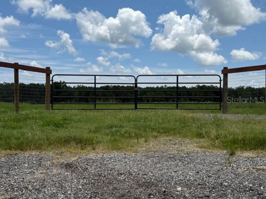 Price Improvement

Welcome to this beautiful and versatile 5-acre parcel, cleared and elevated with added fill, offering a solid foundation for future development. Fully fenced with post-and-board and pasture fencing and gated for privacy, this property is zoned agricultural and is buildable for either a site-built or manufactured home—perfect for your dream homestead or rural retreat.
Additional features include a wood structure/chicken coop, and a small pond, making it ideal for hobby farming, livestock, or simply enjoying wide open space. The property is high and dry, with ample space and the groundwork already in place to start building or farming right away.
This is a rare opportunity to own well-prepared land with flexibility, privacy, and potential.