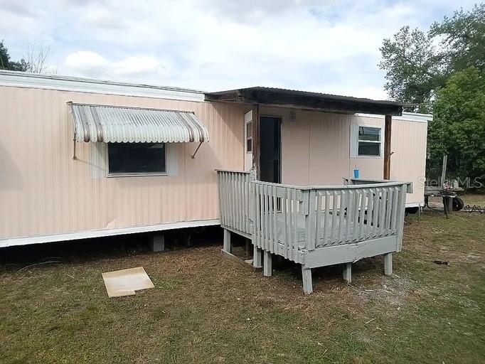 One or more photo(s) has been virtually staged. Recently updated 2 bedroom 1 bath home sitting on 1/3 of an acre, has well and septic. It is about 50 feet from a convenience store and one mile from a Walmart and other shopping. No owner financing.