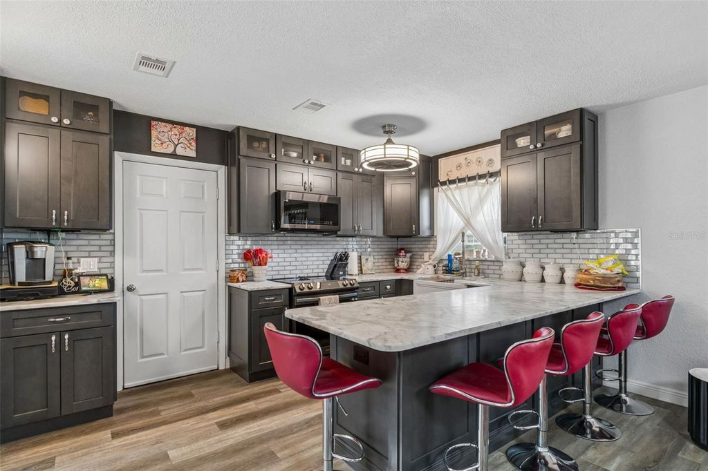 Photo of 1409 Nelson Avenue, Clearwater, FL 33755 (MLS # TB8488195)