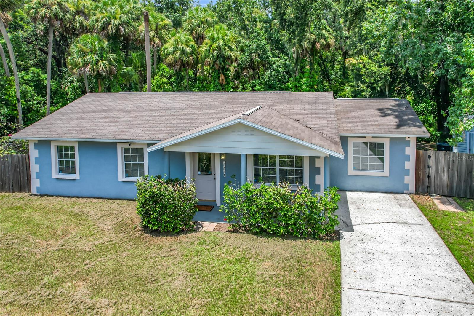 Welcome to your slice of country near city conveniences. This Updated 4 bed 2 bath home is nestled in the heart of Plant City, just 10 minutes from I-4 and charming downtown Plant City. Private oversized lot with wooded view, fenced yard and Large 10x16 shed w light. As you enter through the leaded glass front door you will note the open great room and how the stylish 18 inch tile flows throughout the main living areas. The Eat-In Kitchen has been updated with real wood cabinets w glazed inset detail- simply stunning! The Primary Suite features En-suite bath and Walk-In closet and easy to maintain 3/8 inch gym mat flooring. The secondary bedrooms are amply sized and on a split floor plan for maximum privacy. Other great features are the double pained windows, large inside Laundry room and exterior CC security cameras. Roof and A/C are 2014. No HOA, NO Flood insurance required. All of this on a private Fenced lot with double gate and easy access to the interstate, downtown, shopping& dining. This affordable home offers it all! Call today!