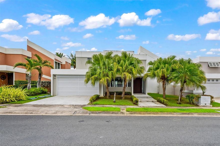 Two-story single family residence remodeled in 2015, located within the Paseo Las Olas complex inside the Los Paseos development in Dorado. The home offers 4 bedrooms and 2.5 bathrooms across approximately 2,250 square feet of construction on a 504 square meter lot. All bedrooms are situated on the second level. 

The first level features the living room, dining area, remodeled kitchen, family room or home office, half bath, and interior laundry near the carport access. The updated kitchen includes matte-finish cabinetry, quartz countertops, waterfall-style center island, porcelain backsplash, gas range, and stainless steel appliances. Bathrooms were remodeled with wood-look tile finishes, and glass-enclosed showers. The primary bathroom features a double vanity and shower panel. 

The home includes 6 inverter mini-split AC units, diesel power generator, electric water heater, covered 2-car carport, and EV charging connection. All appliances included with the sale. 

Paseo Las Olas community amenities include a swimming pool and tennis court, with double controlled access through the Los Paseos main guardhouse and the Paseo Las Olas gated entry. 

Conveniently located near restaurants, hospitals, and schools. HOA approximately $2,200 annually.