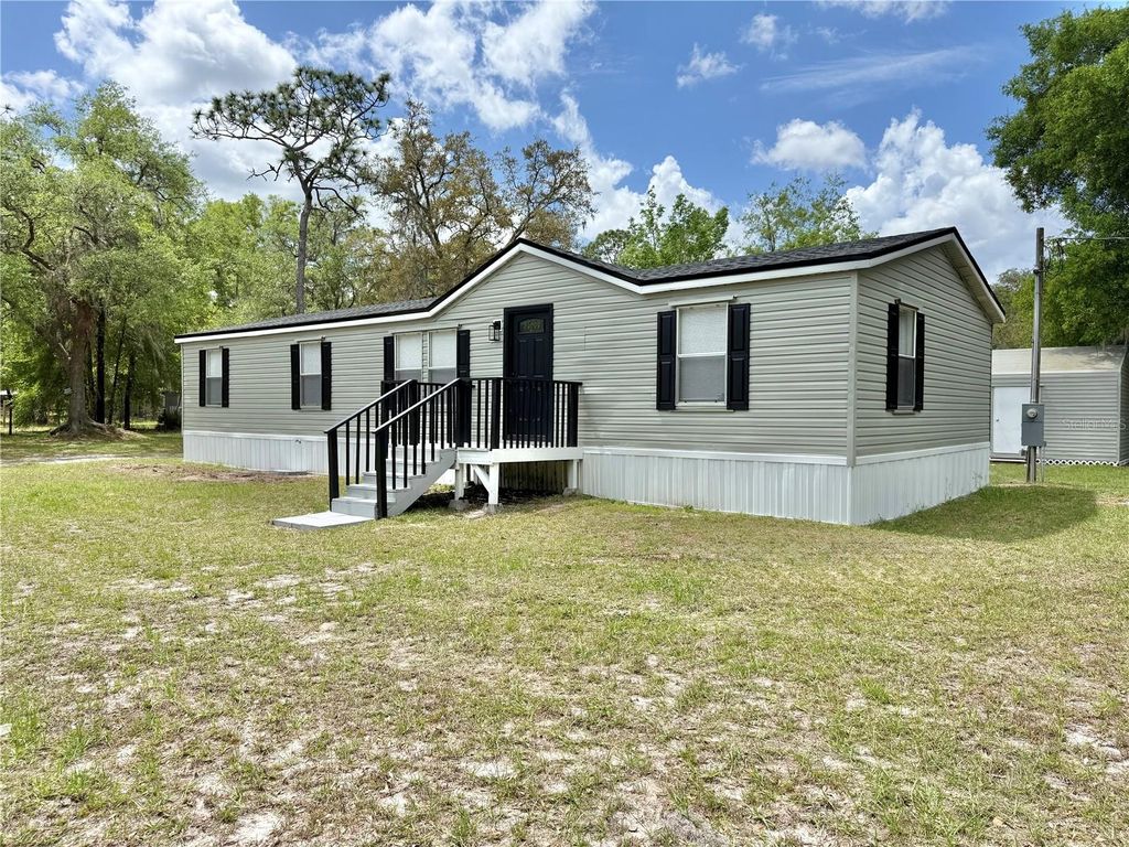 Photo of 15840 SW 100th Avenue, Dunnellon, FL 34432 (MLS # S5147188)
