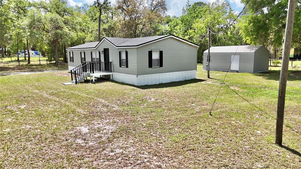 Photo of 15840 SW 100th Avenue, Dunnellon, FL 34432 (MLS # S5147188)
