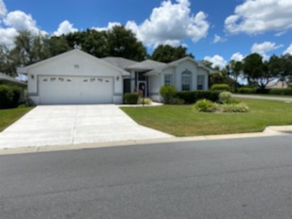 Welcome home! This 3 bedroom, 2 bathroom, oversized 2 car garage with a PRIVATE SOLAR HEATED POOL located on the GOLF COURSE by the 10TH TEE-OFF in 55+ Royal Highlands, is waiting for you to make it your own. Major improvements include a New Roof 2015 and AC in 2010. This open floor plan boasts a spacious great room with extended sliding glass doors that open to the screened patio, offering plenty of space for entertaining guests or just relaxing by the pool. The kitchen features a bright, roomy breakfast nook, breakfast bar, upgraded cabinets, a pantry with pull-out drawers, and a new stainless refrigerator and stove. There are two owners’ suites, one with an en suite bath w/ jetted tub, separate shower, dual sink vanity, and a large walk-in closet. Additional features include a murphy bed, inside laundry with washer and dryer and overhead cabinets, a laundry tub in the garage, a separate formal dining area, screened front entry, volume ceilings, and plantation shutters. Royal Highlands is located within easy access to the FL Turnpike. There are many amenities to offer homeowners including 2 pools (one indoor and one outdoor), lighted tennis courts, 18 hole golf course, restaurant and pro shop, recreation center with numerous activities including billiards, fitness center, activity rooms, a library, etc. Grand hall for social functions, concerts and plays, bocce ball, pickleball, shuffleboard, softball, a driving range and putting practice.