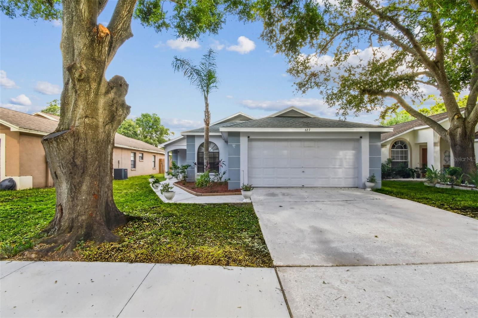 Welcome to 627 Sand Ridge Dr, a well-kept 3-bedroom, 2-bath home with a 2-car garage in the highly sought-after Brentwood Hills community in Valrico. With NO CDD FEES and LOW HOA DUES, this home offers a great blend of comfort, location, and value. Inside, you’ll find 1,300 square feet of functional living space with a split-bedroom layout and vaulted ceilings in the main living area. Wood look LVP flooring runs through the living and dining spaces and bathrooms, with tile in the kitchen, and carpet in the bedrooms. The kitchen features plenty of cabinet and counter space, a closet pantry, and a cozy breakfast nook, ideal for casual meals or morning coffee. Sliding glass doors lead from the living room to a fully fenced backyard featuring a pavered patio and gazebo, perfect for outdoor dining, relaxing, or entertaining. The spacious primary suite features a tall, sloped ceiling and an updated en-suite bath with a comfort-height toilet, modern vanity, framed mirror, and recessed lighting. On the opposite side of the home, two guest bedrooms share a beautifully remodeled bathroom with a walk-in tub/shower lined with subway tile, built-in niches, and another comfort-height toilet. Upgraded fixtures and ceiling fans are installed throughout the home. Brentwood Hills offers excellent community amenities including a pool, clubhouse, tennis and basketball courts, soccer field, multiple playgrounds, and a dog park. It’s a neighborhood with true pride of ownership,and without the extra cost of CDD fees. Located just east of Tampa, Valrico gives you suburban living with easy access to everything: top-rated schools, shopping, dining, and major routes like State Road 60. If you're looking for a clean, move-in-ready home in a great neighborhood, 627 Sand Ridge Dr checks all the boxes.