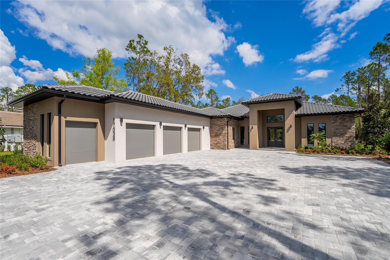 Under contract-accepting backup offers. This stunning home is nestled in the exclusive, private community of Bella Collina, one of Central Florida’s most prestigious neighborhoods. The custom-designed residence boasts 5 spacious bedrooms, 5 full bathrooms, and 1 half bathroom. The kitchen is a chef’s dream, featuring high-end Fisher and Paykel appliances, a quartz island countertop, oversized cabinets, and a generous walk-in pantry. The backyard is an entertainer’s paradise, complete with a summer kitchen, pool, spa, automatic screen enclosure, and ample space on a 1.3-acre premium lot that backs up to a serene preserve.
Bella Collina itself offers unparalleled amenities, including a guard-gated entrance, a Sir Nick Faldo-designed golf course, a 75,000-square-foot Tuscan-style clubhouse with dining options, a spa, fitness center, tennis courts, and a large swimming pool. The community is ideally located in Montverde, close to major theme parks, Florida’s stunning beaches, the popular West Orange Trail, and the vibrant downtown areas of Clermont and Winter Garden, with their unique shopping, dining, and craft breweries. Bella Collina is also just minutes away from the prestigious Montverde Academy.