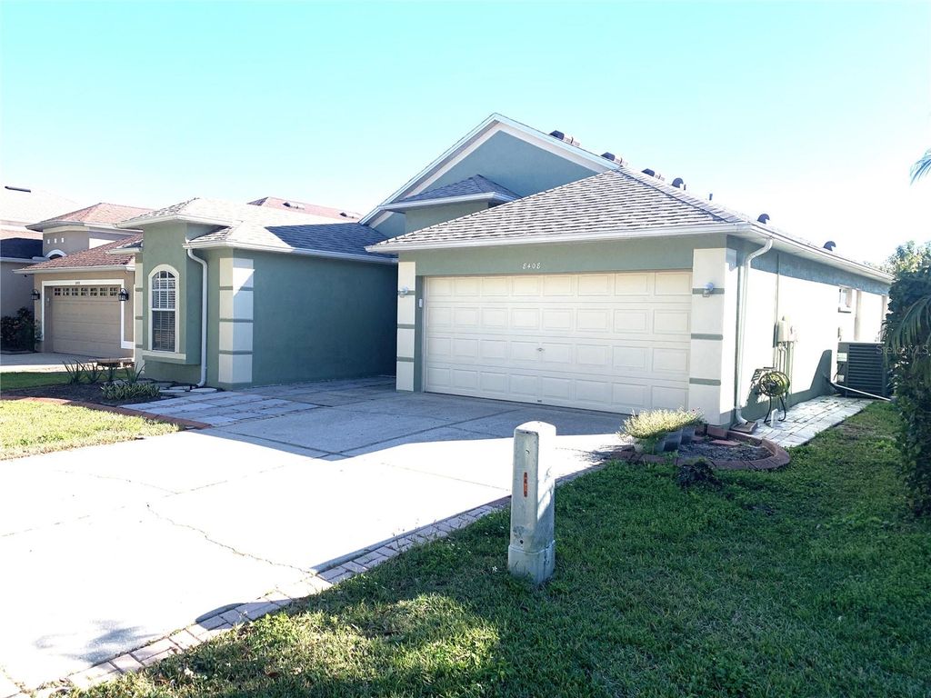 Photo of 8408 Canterbury Lake Boulevard, Tampa, FL 33619 (MLS # TB8454025)