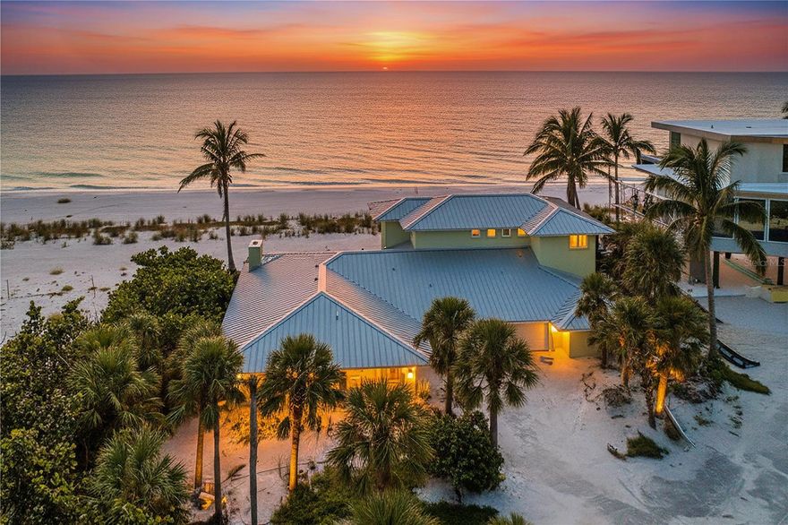 Discover a truly rare opportunity to own two parcels in a new, beachfront enclave being developed with private entry gates directly on the pristine sugar sand and turquoise waters of the Gulf of Mexico. The offering includes: Parcel One - Property ID: 7847710154 - 20,000 sq. ft. homesite with 100 ft. of direct Gulf frontage. Parcel Two - Property ID: 7847700007 - A 9,757 sq. ft. privately owned, secluded cul-de-sac providing private access for just two Gulf-front estates, ensuring unmatched exclusivity. Nestled at the end of North Gulfside Road. This serene setting offers endless views, peaceful surroundings, and an unparalleled level of privacy.  The existing residence sustained significant damage during hurricane Helene and can be transformed into a modern coastal retreat or removed to create a brand-new luxury tropical estate.  Enjoy the very best of Gulf-front living—quiet, private, and breathtakingly beautiful.   This is an active construction site with restricted access.