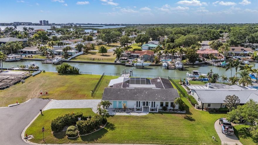 One or more photo(s) has been virtually staged. Experience the ultimate Florida waterfront lifestyle in this stunningly updated pool home located in the highly sought-after Oakhurst Shores community. Perfectly positioned on an oversized corner lot along a deep-water canal, this 3 bedroom, 2 bathroom, residence with two bonus rooms offers the ideal blend of luxury, comfort, and direct boating access just minutes to Boca Ciega Bay, John’s Pass, and the Gulf waters beyond.

From the moment you arrive, the upgrades and attention to detail are impossible to miss. This beautifully renovated home features brand-new flooring, custom woodwork, updated interior doors, and stylishly redesigned kitchen and bathroom cabinetry. Hurricane-rated front and garage doors, along with four newer hurricane-rated sliding glass doors, not only provide peace of mind but also flood the home with natural light and seamless indoor-outdoor living.

Inside, the open-concept layout was designed to maximize both space and views. The kitchen, dining area, and family room all overlook the sparkling pool and waterfront, creating the perfect setting for entertaining or simply enjoying everyday coastal living. A versatile flex space adjacent to the family room offers endless possibilities and is currently used as a home office, gym, and laundry room — because laundry belongs inside, not in the garage. A separate formal living room at the front of the home provides even more room to spread out and entertain.

The spacious primary suite features two built-in closets and a beautifully updated en-suite bath with a large walk-in shower. Two additional bedrooms offer comfortable accommodations for family and guests alike.

Step outside and your private backyard oasis awaits. Relax by the freshly resurfaced pool with a brand new screened lanai, entertain on the expansive outdoor living space, or hop on your boat from the private dock equipped with a 9,000-pound lift and spend the day exploring the water.

This is more than just a home — it’s a lifestyle. Waterfront living, boating, entertaining, and unforgettable sunsets all come together in one exceptional property. Schedule your private showing today and experience the best of coastal Florida living.