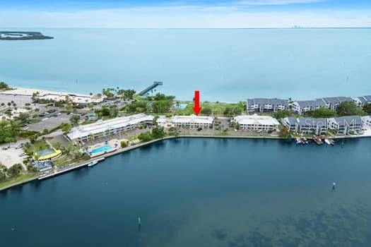Vacation resort living for yourself or investment income: Welcome to 611 Destiny Drive, Unit 210—your gateway to relaxed waterfront living and/or income opportunity in the tranquil community of Little Harbor. This fully furnished second floor condo is an ideal second home or vacation rental, offering a cozy and convenient retreat, designed to make your stay effortless. Step outside and immerse yourself in the resort-style amenities that make Little Harbor a sought-after destination. Enjoy two heated pools, a sandy beach, and a gym, and tennis courts. For boating enthusiasts, the deep-water marinas and the Freedom Boat Club offer direct access to the Bay and Gulf, making it a boater’s paradise. Or explore the serene waters by canoe or kayak. Little Harbor also features beachfront tiki bar, and Restraunt where you can soak in stunning sunset views and enjoy live music. Little Harbor’s vibrant community also features waterfront dining, a clubhouse, and playgrounds for all ages. This property isn’t just a tranquil getaway—it’s a smart investment opportunity. Ideally situated just a short drive from Tampa, St. Petersburg, and Sarasota, this condo offers the perfect blend of relaxation and convenience, with nearby shopping, hospitals, restaurants, and golf courses.