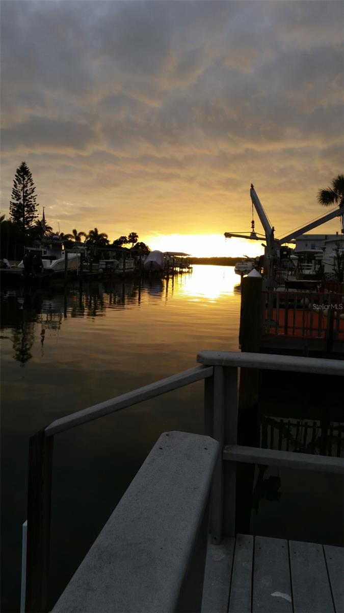 ***Direct Gulf access – no bridges, no tides to contend with!** Step out your door and onto your private dock, perfect for launching your boat, fishing, kayaking, paddle boarding, or simply soaking up the sun. The dock has been recently redone with new pilings and professionally wrapped, ensuring durability and peace of mind for years to come. Located in a 55+ community, you can bring your boat and keep it on your own personal dock right in your backyard. Just a few lots in on the canal from open water, you’ll enjoy a quick and easy ride to John’s Pass. The seawall, maintained by the community, was redone some years back and remains in excellent condition. Low HOA fees! At only $255/month, dues cover water, sewer, trash, lawn maintenance, and use of the community pool & clubhouse—making waterfront living surprisingly affordable. Stunning views: Relax with serene evening sunsets and the gentle sound of the water lapping; this is the Florida waterfront lifestyle you’ve been waiting for. Don’t miss out on this opportunity!
