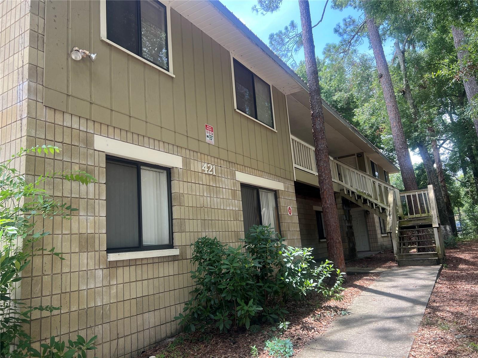 This spacious upstairs 2-bedroom, 2-bathroom unit is available now and offers comfort and functionality throughout. Enjoy a double vanity and double closet in the primary suite, ceiling fans in every room, and a private back balcony perfect for relaxing. The galley-style kitchen provides ample cabinet space and opens into a combined dining and living area, great for everyday living or entertaining. With carpeted bedrooms, in-unit laundry connections, and generous closet space, this home has everything you need. Trash and lawn care included! Available now!