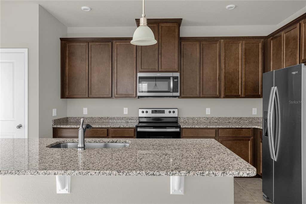 Photo of 1926 Holden Ridge Lane, Clermont, FL 34715 (MLS # O6427492)