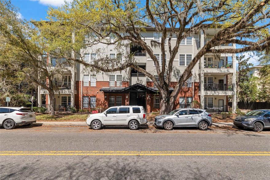 WALK TO THE UNIVERSITY OF FLORIDA, UF HEALTH SHANDS HOSPITAL, AND SORORITY ROW! This TOP FLOOR 3 bed/3 bath condo is located in the only 3 bedroom Campus View condo building with an elevator, offering a rare combination of space, upgrades, and convenience. This move-in ready unit features an open layout with a large kitchen showcasing upgraded granite countertops and backsplash. The dining room includes a custom built-in banquette with extra storage underneath, a dry bar, and an elevated breakfast bar for casual dining. Off the spacious living room, a large covered patio offers a quiet view of a wooded area. Each of the three bedrooms is generously sized and includes its own bathroom and large closet, and all bathrooms have been upgraded with matching granite countertops. Other upgrades include premium flooring in the common areas, upgraded canned lighting in the entry hallway, and Ethernet connections in all bedrooms. Energy efficiency improvements include professionally installed 3M window films on all bedroom windows, refreshed attic insulation, plus a whole-condo dehumidifier - ideal for those sensitive to humidity and allergens. Major systems - including the full-size washer and dryer (Maytag Commercial Technology), water heater, HVAC, stainless steel Kenmore Elite refrigerator, Bosch dishwasher, and garbage disposal - have all been replaced within the last 9 years. The building also saw major exterior improvements with a new roof and exterior paint completed in 2025. The unit also includes a premium parking space just steps from the elevator. A rare opportunity to own a well-maintained condo in one of the most walkable locations to UF Campus, UF Health Shands Hospital, and Sorority Row!
