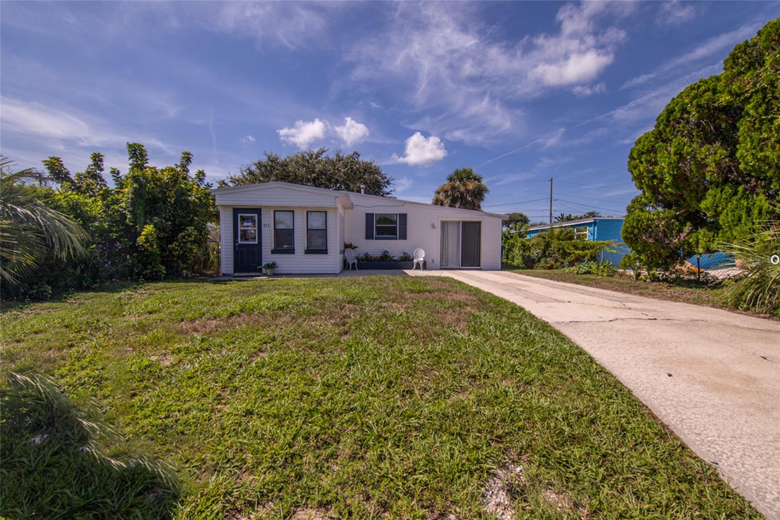SWEET DREAMS AT THE BEACH! Concrete Block Beachside Bungalow on a great street just a short distance to the Beach or River with this cute freshly painted 3 bedroom, 2 full bathrooms with an indoor laundry plus all Newer: Hot Water Heater 2022, HVAC 2023 & Roof 2017. Adjacent to the living space offering a flexibility for your guests with a second full bathroom. Enjoy the large area that could be used as guest retreat, family room, workout room or office. Kitchen has been modernized with butcherblock and newer appliances. Tile flooring makes easy care throughout the home, wood-grained tiles enhance both style and durability. Step outside to enjoy the screened in patio, and a spacious backyard, perfect for entertaining and relaxing. Screened patio for those lazy afternoon naps with the beach breezes or dining al fresco. Fenced yard with storage shed for all your toys. Ready to move-in, today. This is your opportunity to live your dream of the Florida Lifestyle in this beachside paradise!
