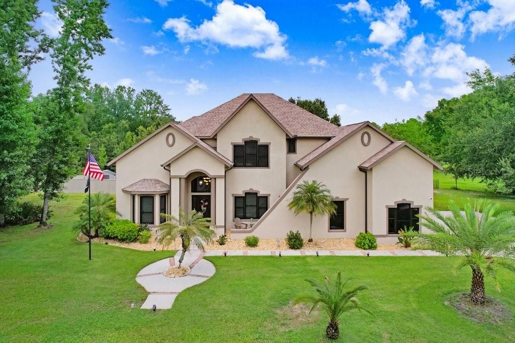 Photo of 8935 Woodleaf Boulevard, Wesley Chapel, FL 33544 (MLS # TB8411136)