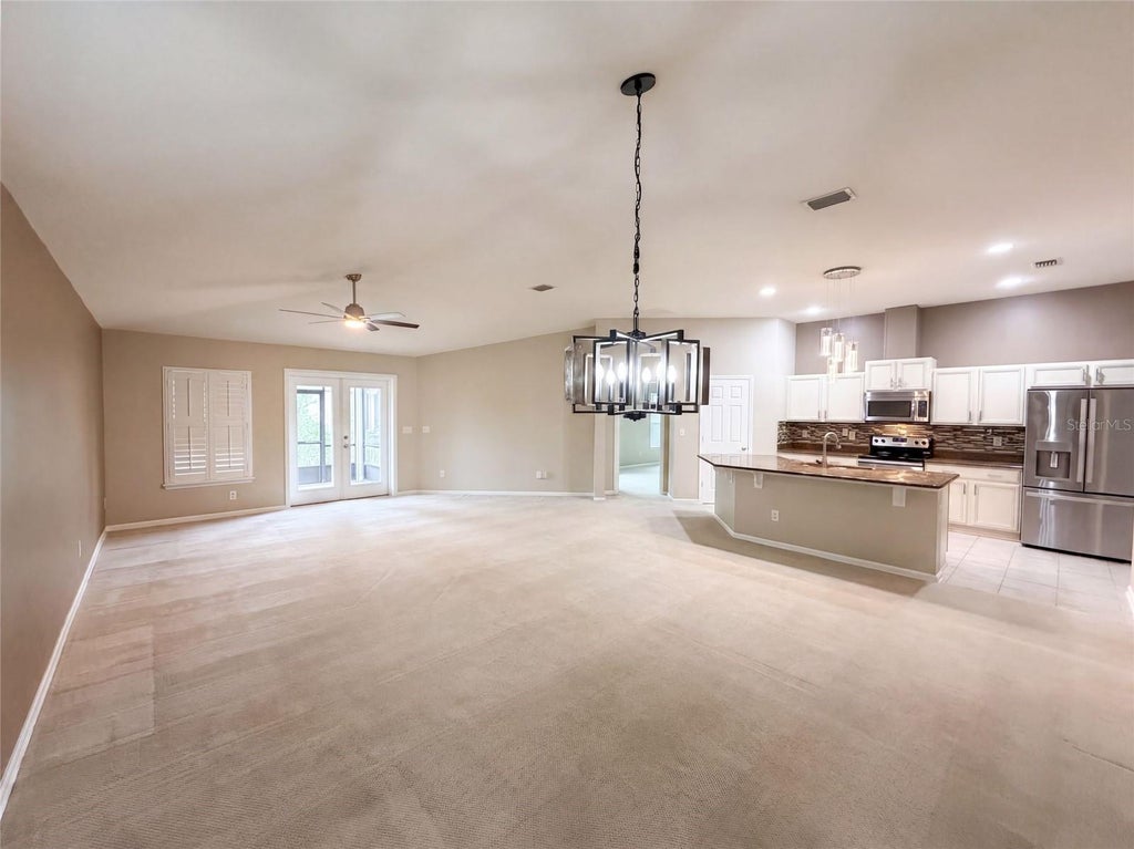 Photo of 120 Prestwick Grande Drive, Daytona Beach, FL 32124 (MLS # O6440263)