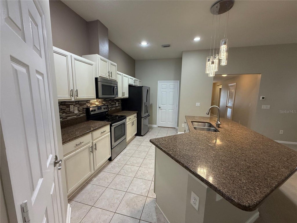 Photo of 120 Prestwick Grande Drive, Daytona Beach, FL 32124 (MLS # O6440263)