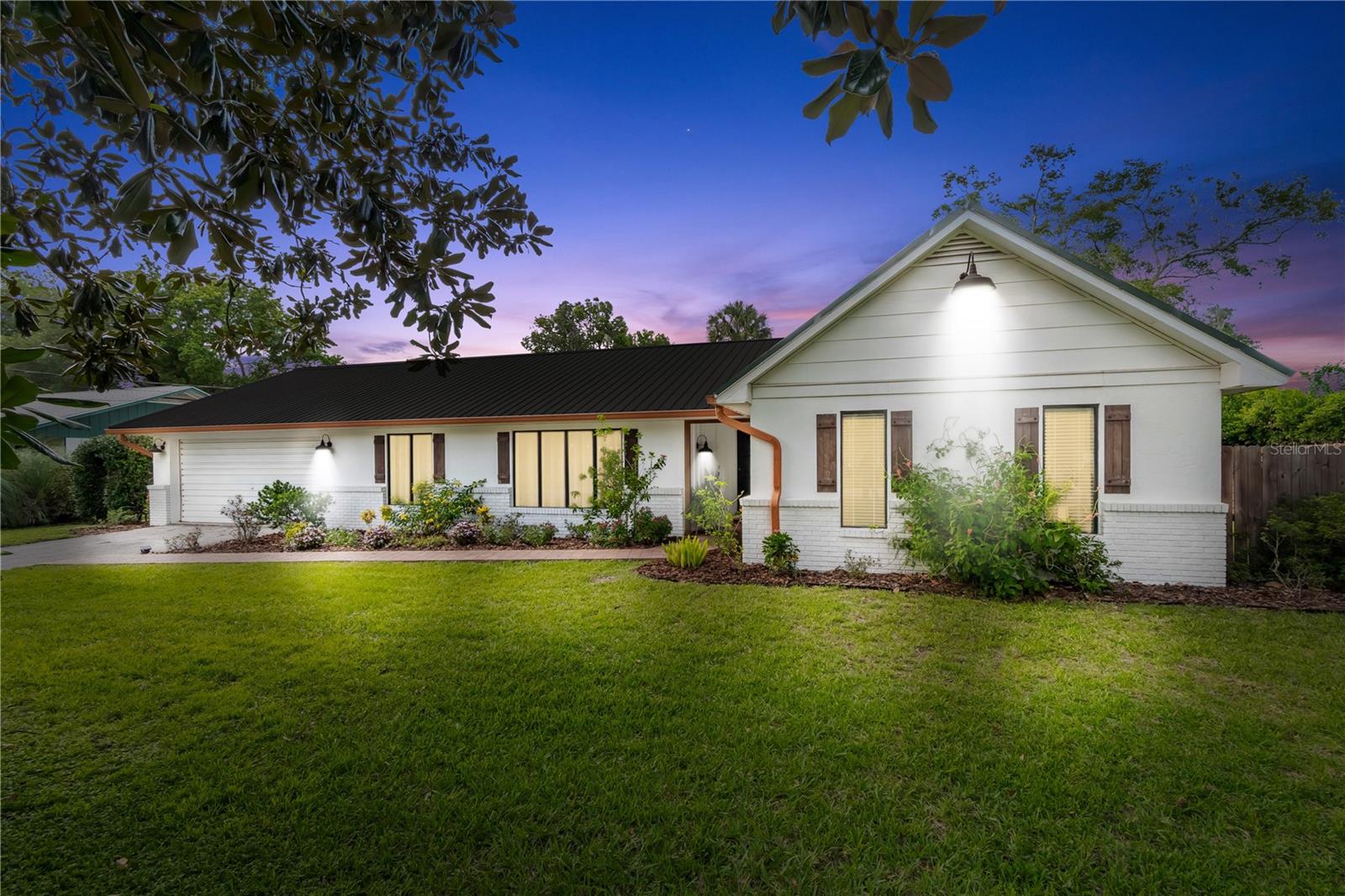Fully renovated 4BR/2BA Ocala home with saltwater pool & MIL suite! Open-concept layout features updated finishes, built-in library, and a cozy fireplace. Backyard oasis boasts a large in-ground saltwater pool, child-safe security fence, privacy fenced yard, mature landscaping, and covered patio perfect for Florida outdoor living. The attached in-law suite has a private entry and its own mini-split A/C—ideal for multi-generational living or rental income. Two-car garage includes built-in workshop. Some photos have been virtually edited for illustrative purposes. Located just 2 miles from Downtown Ocala, 10 minutes to Silver Springs State Park, and 25 minutes to the World Equestrian Center (WEC)—you’re near parks, shopping & dining while still tucked into a quiet residential setting!