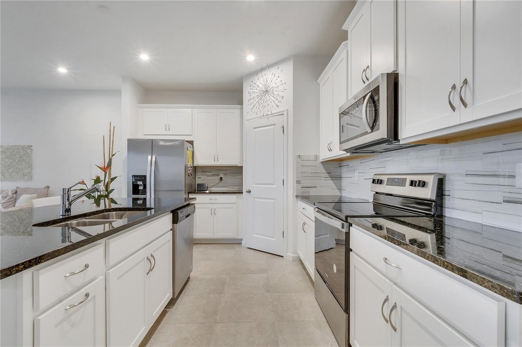 Photo of 1098 Boardwalk Place, Kissimmee, FL 34747 (MLS # O6428335)
