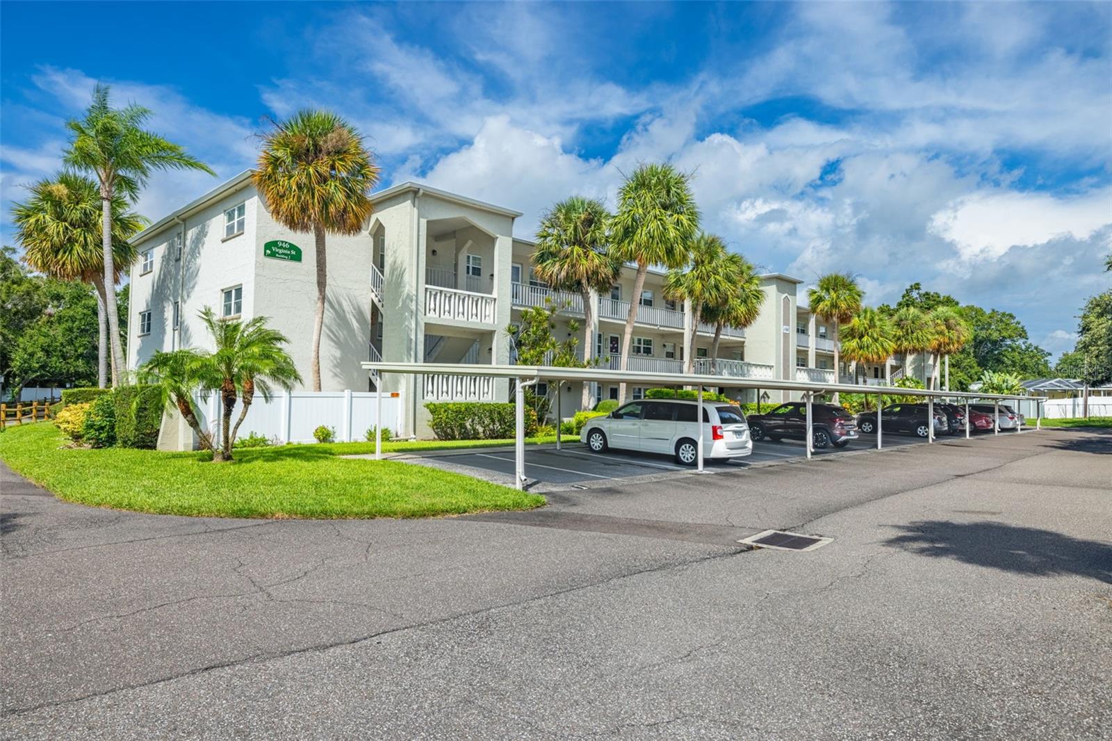 Picture yourself in the heart of Dunedin, where every day feels like a getaway. In the coveted 55+ community of Heather Lake, this beautifully updated condo invites you to slow down and enjoy the unbeatable view of the tranquil pond from your own screened-in balcony. As you arrive at your assigned carport, take the elevator to the second floor to where your new home awaits. Featuring 2 bedrooms and 1 bathroom, this home showcases a thoughtfully designed open floor plan with a living/dining room combo, plantation shutters on all windows and luxury vinyl plank flooring throughout. The light filled kitchen boasts granite countertops and stainless steel appliances, including a newly installed dishwasher in 2024. One of the bedrooms is thoughtfully designed with a built-in Murphy bed, making it the ultimate flex space, an office by day and a comfortable guest retreat by night. The bathroom has been tastefully updated with a modern vanity and a glass door enclosed stand up shower. This home features updated light fixtures and ceiling fans throughout. Additional highlights include a 2021 A/C unit, 2023 electrical panel, brand new roof in 2024, and roll-down hurricane shutters on the porch providing peace of mind for years to come. Heather Lake community offers a clubhouse, heated pool, shuffleboard, walking paths, and is next door to brand new pickleball courts and a community garden. Monthly HOA fees cover cable, internet, water, sewer, trash, exterior maintenance, grounds care, and pool upkeep. Located just minutes to Downtown Dunedin, you’ll find an endless variety of shops, waterfront restaurants, microbreweries, and weekly events along the marina and Main Street. The Pinellas Trail, perfect for biking or walking, runs right through downtown, while the Dunedin Causeway provides a scenic route to Honeymoon Island and Caladesi Island, two of Florida’s most beloved state parks. World-famous Clearwater Beach is just 15 minutes south, while Tampa International Airport and St. Pete–Clearwater International Airport are both easily accessible for travel. For golf enthusiasts, the historic Dunedin Golf Club and renowned Innisbrook Golf and Tennis Resort are close by, and for healthcare peace of mind, Mease Dunedin Hospital is only a short drive away. Whether you’re looking for a full-time residence or seasonal retreat, this property offers more than a home, it offers a lifestyle. Schedule your private showing today and experience the magic of Heather Lake living!