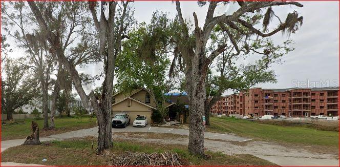 Terrific location. Across from St. Joseph's Hospital. Apartments abut this property. Value is in the Land. Call Hillsborough County for information regarding zoning variance and development possibilities. Land is just under 1 acre. Mixed use varriance has been recently obtained by neighboring lots. Please do not disturb the tenants. Possible owner financing.