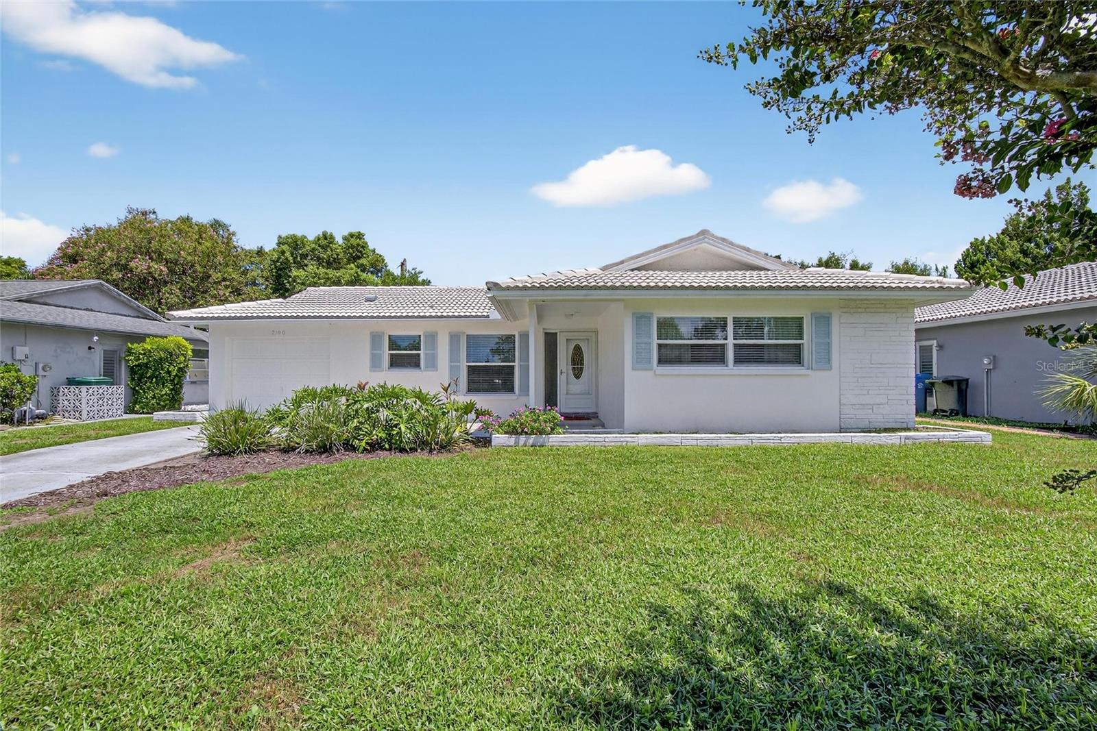 Super chic, fully renovated, and move-in ready—this beautifully remodeled 2-bedroom, 2-bath block home with a 1-car garage is a rare find in Clearwater’s sought-after Greenbriar community. With 1,255 sq ft of heated space (1,756 total), this home is tucked away on a peaceful dead-end street, offering both style and serenity.
Inside, the open floor plan is flooded with natural light and showcases stunning design choices throughout. The kitchen has been thoughtfully redesigned with brand-new cabinetry, quartz countertops, modern appliances, ample storage, and a window that fills the space with sunlight. Both bathrooms have been completely remodeled, and all closets feature updated organizational systems—making smart use of every inch. The spacious primary suite includes two closets, one of which is a walk-in.
The Florida room is ideal for a reading nook, home office, or TV lounge. Stylish flooring runs throughout, and there's generous storage space throughout the home and garage.
Recent upgrades include a new 3-ton HVAC system (2023), new water heater (2022), Plumbing (3/2022), LVP Flooring throughout and a new lanai roof (2023). The tile roof has a potential lifespan of up to 50 years. Additional features include a Whirlpool water softener, sprinkler system with irrigation well pump, and a location outside of a flood zone for added peace of mind.
Greenbriar is known for low annual HOA fees and a friendly, well-kept atmosphere. Residents enjoy a heated community pool, clubhouse with a fitness center, library, game room, and shuffleboard courts.
Prime location close to Clearwater Beach, Downtown Dunedin, Westfield Countryside Mall, shopping, dining, hospitals, and two international airports. Also nearby is the Gladys E. Douglas Preserve, with 44 acres of scenic trails and an 80-acre lake for kayaking, fishing, and wildlife viewing.
This home is a rare blend of thoughtful design, modern updates, and a location that puts you at the heart of everything. Don't miss this one!