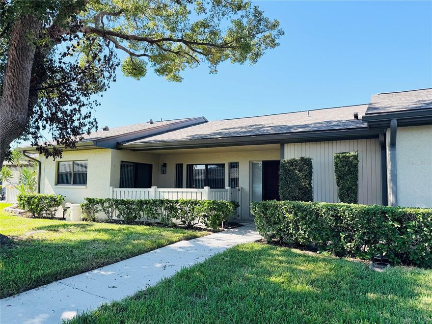 Beautifully Renovated Villa on Serene Pond in Quail Forest. Welcome to this stunningly updated 2-bedroom, 2-bath villa located in the desirable gated community of East Lake Woodlands. Enjoy peaceful pond views and a modern, comfortable lifestyle in this move-in-ready home. Inside, you’ll find tastefully renovated bathrooms and hard-surface flooring throughout. Both bedrooms provide private en-suite baths and generous closet space. The bright and inviting kitchen features light cabinetry, stainless steel appliances, and a dining area—plus a convenient wet bar with abundant storage. Sliding doors from the kitchen and dining area open to a private patio, perfect for grilling or enjoying your morning coffee. The large enclosed Florida room adds over 200 sq. ft. of versatile living space—ideal for a home office, den, or reading nook. Additional features include an in-unit washer and dryer, a storage closet off the Florida room, a covered carport, and guest parking. Residents also enjoy maintenance-free living and access to the community pool.