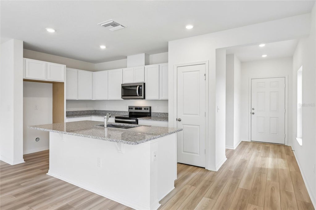 Photo of 671 Meadows Edge Place, Lake Wales, FL 33859 (MLS # O6443312)