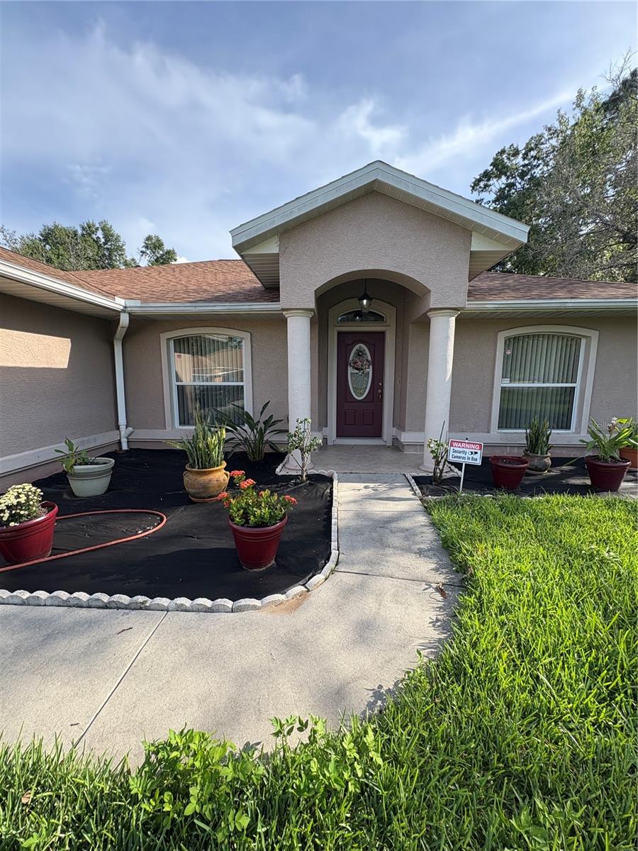 Welcome to this cute Move In home in Ocala! This fully furnished, well-maintained home offers comfort, convenience, and peaceful Florida living. Featuring an efficient A/C system mounted above the garage, outdoor security cameras, and a spacious yard with fruit trees, this property is perfect as a seasonal retreat or full-time residence. Inside, you'll find a clean and inviting layout that's been lovingly cared for—ready for you to move in and make it your own. Laundry appliances not included.