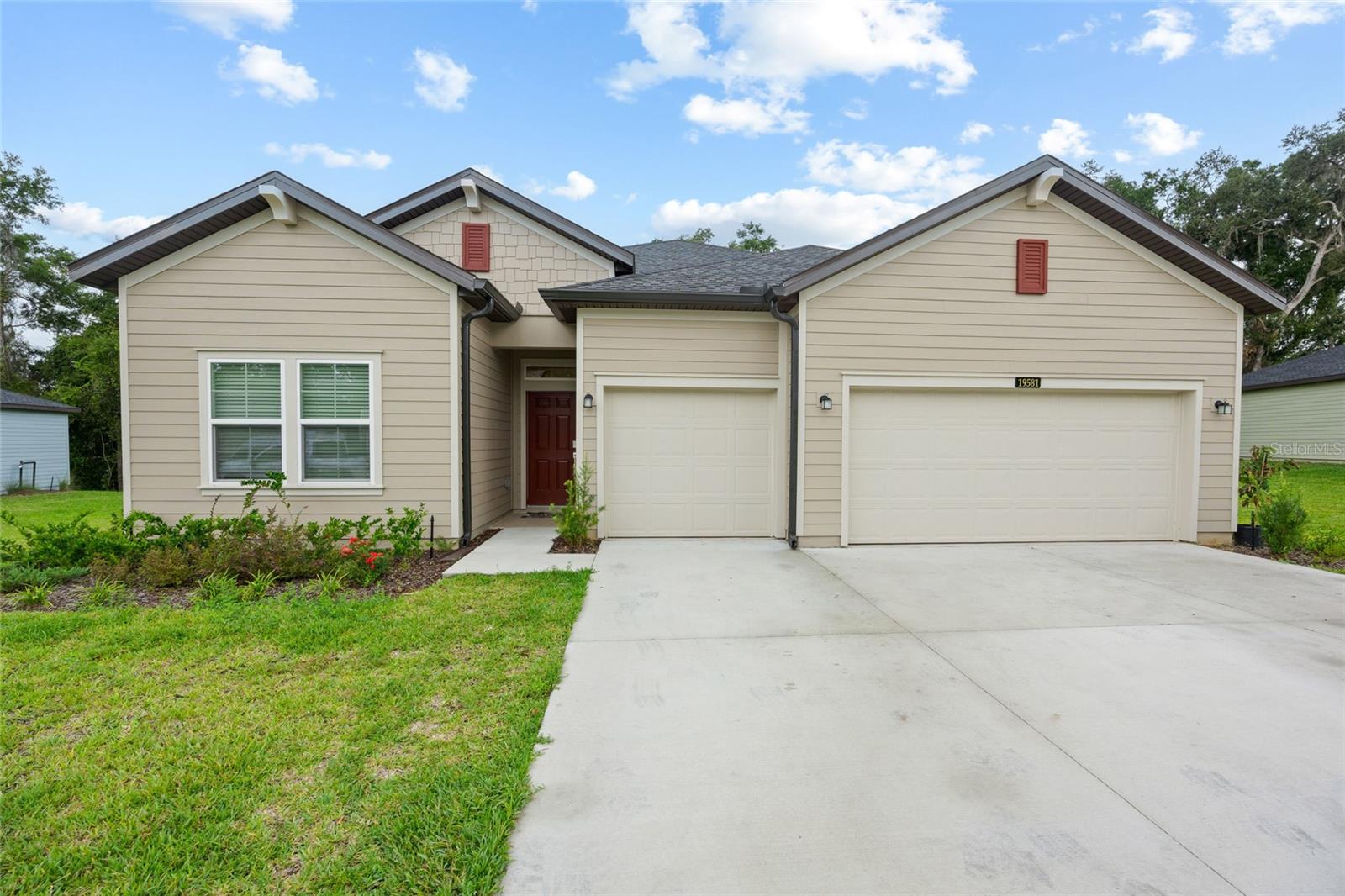 Welcome to this stunning 2024-built Tivoli model home located in the highly sought-after Grand Park North community in Dunnellon, FL! This 4-bedroom, 3-bathroom home features all-tile flooring throughout—perfect for easy maintenance and a sleek, modern look. One of the bedrooms includes a private en-suite bath, ideal for guests or multigenerational living. The spacious primary suite boasts a luxurious bathroom with both a walk-in shower and a soaking tub.
Enjoy outdoor living on the screened-in porch, and admire the gorgeous epoxy-finished floors in the spacious 3-car garage.
Grand Park North offers unbeatable amenities including private access to the clubhouse, resort-style pool, fitness center, and the crystal-clear Rainbow Springs River—exclusive to residents. Don’t miss the opportunity to own a piece of paradise with all the perks of upscale community living!