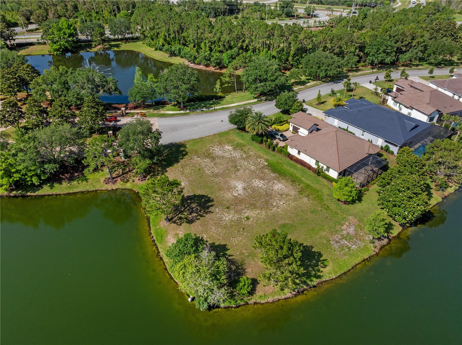 **Once-in-a-Kind Lakefront Lot in The Conservatory, Palm Coast!**Welcome to 211 Conservatory Dr, a rare opportunity to own a premier .32-acre (13,960 sq ft) luxury lakefront lot in the exclusive, gated Hammock Beach Conservatory Golf Community. This exceptional homesite is cleared and pad-ready, offering a spectacular 270-degree water view with three tranquil fountains—perfect for building your dream home in paradise. A full survey is available for your convenience. The Conservatory at Hammock Beach is nestled within Palm Coast, this property provides access to one of Florida’s most sought-after private communities. Enjoy 24-hour gated security, beautifully manicured grounds, and a sense of privacy and exclusivity. The Conservatory features the renowned Tom Watson-designed golf course, considered the crown jewel of Palm Coast, with rolling fairways and stunning vistas at every turn. As a resident, you’ll have the option to join the Hammock Beach Club, unlocking a world of luxury amenities: Two World-Class Golf Courses: The Conservatory Course (Tom Watson) and the Ocean Course (Jack Nicklaus), Tennis courts and state-of-the-art fitness centers, Lavish resort-style pools and a full-service spa, Upscale dining options and social clubs, Private beach access for residents and guests, Miles of scenic walking and biking trails**Coastal Living at Its Finest** Enjoy the best of coastal Florida living with easy access to pristine beaches, boating, fishing, and all the natural beauty Palm Coast has to offer. Whether you’re seeking a peaceful retreat or an active lifestyle, 211 Conservatory Dr. is your canvas to create the ultimate luxury residence. Don’t miss this once-in-a-lifetime opportunity to secure a prime lakefront lot in the heart of the Hammock Beach Conservatory.
