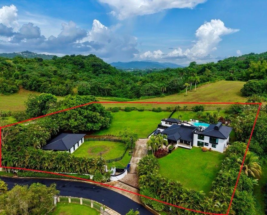 Equestrian Luxury Estate in Guaynabo – A Private Ranch for Horse Lovers in Puerto Rico

Welcome to one of the most exclusive properties in the Puerto Rico luxury real estate market. This extraordinary equestrian estate is located in Lomas del Sol in Guaynabo, offering a rare combination of refined living, natural beauty, and equestrian excellence. Perfectly positioned on 1.4 private acres, this estate is ideal for those who dream of owning a private ranch in Guaynabo, Puerto Rico, without sacrificing access to the conveniences of urban life.

Luxury Design and Spacious Living

This custom-built residence boasts four spacious bedrooms and five luxurious bathrooms across 4,535 square feet of interior living space. Designed with elegance and comfort in mind, the property blends timeless architecture with modern finishes. From the moment you enter, you're welcomed by light-filled spaces, soaring ceilings, and seamless indoor-outdoor flow—perfect for entertaining and everyday luxury living.

A True Equestrian Experience

What truly sets this estate apart is its dedication to the equestrian lifestyle. For serious horse lovers, this is a one-of-a-kind opportunity to own a fully equipped horse ranch for sale in Puerto Rico. The property includes top-tier facilities designed specifically for Paso Fino horses, with spacious stables, training areas, and room for grazing—all integrated into the lush tropical landscape. Whether you're a seasoned rider or a passionate enthusiast, this is the ideal setting to enjoy your horses in a private, secure, and scenic environment.

Resort-Style Outdoor Amenities

Outdoor amenities elevate the experience even further. A resort-style pool surrounded by palm trees and landscaped gardens invites you to relax under the Caribbean sun. Entertain in style with a handcrafted wood-fired pizza oven and a custom outdoor bar, ideal for hosting guests or enjoying a quiet evening with family. Every element has been thoughtfully designed to provide the ultimate in Caribbean luxury.

Prime Location in Guaynabo

This estate is more than just a home—it's a lifestyle. Located just minutes from some of the best private schools in Puerto Rico, such as  Marista and Baldwin, it offers the perfect balance of seclusion and connectivity. Lomas del Sol is one of the most desirable communities in Guaynabo, known for its privacy, security, and access to top-tier amenities. You can live your passion for horses while staying close to the shopping, dining, healthcare, and cultural centers of San Juan.

The property also caters to those specifically interested in:

Luxury equestrian homes for sale in Puerto Rico, Homes for sale in Puerto Rico with horse stables, Mansions in Puerto Rico, Luxury homes Puerto Rico buyers seek or A private ranch in Guaynabo, Puerto Rico


Live the Life You Deserve

It is rare to find a private ranch in Guaynabo, Puerto Rico that meets the needs of both luxury living and serious equestrian pursuits.  Whether you are relocating to Puerto Rico, investing in real estate, or simply searching for your dream home, this residence deserves your attention.

This is more than a property—it’s a personal paradise where you can breathe deeply, ride freely, and live exquisitely. For those who refuse to settle for anything less than the best, this is your moment. Guaynabo homes for sale with equestrian features are rare, and the level of privacy, design, and function offered here is even rarer.