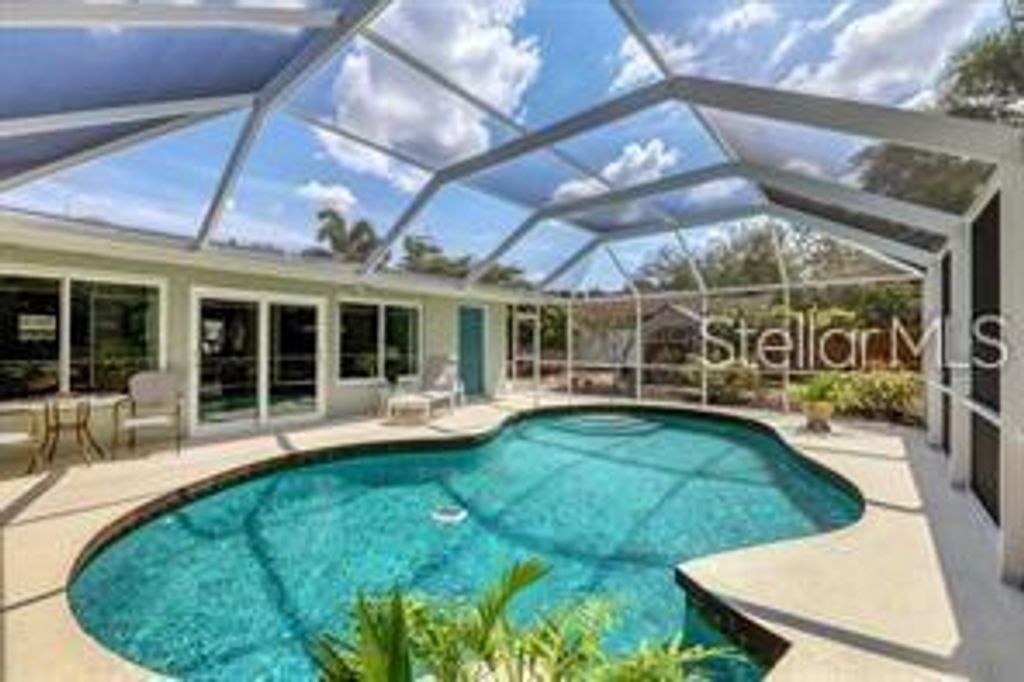 Photo of 7860 Holiday Drive, Sarasota, FL 34231 (MLS # A4691644)
