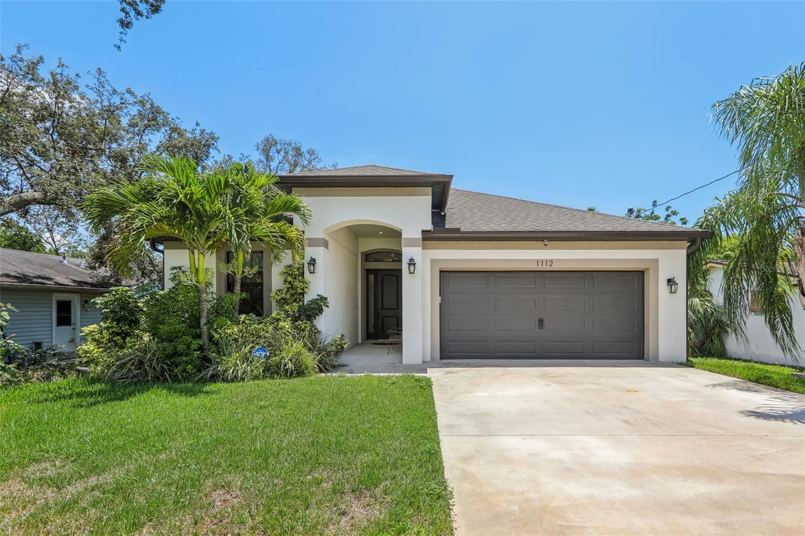 Experience the best of Florida living with this custom-designed sanctuary, where luxurious indoor living effortlessly merges with the quintessential Florida outdoor lifestyle. Built in 2019 by a local building designer this exceptional home offers a rare opportunity to own a newer construction property in the heart of the charming Tarpon Springs community. Step inside and be captivated by an open-concept living space defined by soaring 9-foot ceilings and an abundance of natural light. The heart of the home is a chef's dream kitchen, featuring stunning quartz countertops, high-end cabinetry, and a massive center island that comfortably seats four. This central gathering space blends seamlessly with the main living area, creating the perfect environment for entertaining or relaxing. The true magic of the home is revealed through the expansive, multi-slide glass doors that vanish to connect the interior with an extraordinary 800+ square foot screened lanai. With impressive 13-foot ceilings and a swim spa, this outdoor haven is an extension of the living space, offering an unrivaled setting for year-round enjoyment, whether you're hosting a gathering or simply unwinding in your private retreat. The split floor plan ensures privacy and comfort. The spacious master suite boasts two generous walk-in closets, a double vanity, and a large walk-in shower. Two additional well-appointed guest bedrooms and a full guest bathroom are located on the opposite side of the home.
This property is perfectly positioned for those who love the outdoors. Located outside of a flood zone, you are just moments away from the natural beauty of Highland Nature Park and the boat ramps and fishing spots at Anderson Park. Explore the quaint downtown area of Tarpon Springs or spend a day at the pristine sands of Howard Park Beach, widely considered one of the area's best. This is more than a home; it's a lifestyle waiting to be lived. Don't miss your chance to own this custom-built masterpiece that perfectly blends modern luxury with the rich history and vibrant outdoor culture of Tarpon Springs.