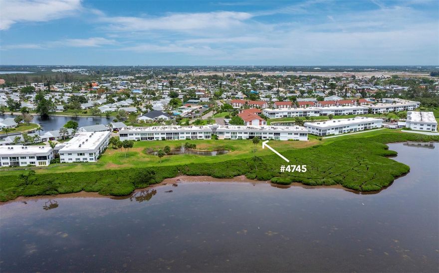 OUTSTANDING VALUE -- for a direct BAYFRONT condominium, with sweeping panoramic views to the west combined with the enjoyment of nightly sunsets. Multiple upgrades including tile floors, recessed lighting in the kitchen, a farm house sink, quartz counters, a pantry, breakfast bar and a full size washer and dryer. The A/C is 8 months new as is the hot water heater. The guest bedroom has a Murphy bed providing ample room for a home office. This two-bedroom, two-bath beautifully decorated residence is being offered turnkey furnished. The roof on the "D" building is 2 years old. Mount Vernon has incredible amenities such as a clubhouse with a library, meeting rooms for any occasion, a ballroom, a billiards room, pool, tennis, pickleball, fitness room, shuffleboard, bocce, kayak launching area, boat dockage and more. Restaurants are close by, and Coquina Beach on Anna Maria Island is only four miles away. This is a 55+ community. The sale is subject to honoring a tenant already in place from December 1, 2025, to March 31, 2026, for providing instant income.  24 hours notice required for showings. Life does not get any better than this at any price!