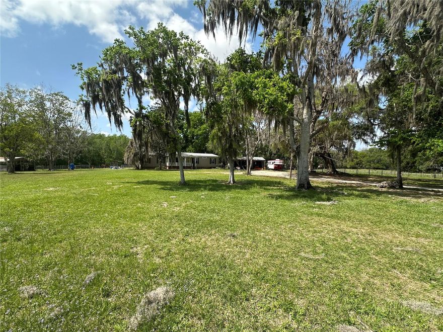 18+ acres tucked away on a private road offering peaceful farm living in a prime equestrian location. The property features a 3-bedroom, 2-bath home and is conveniently located near Williston, Gainesville, and Ocala—approximately 16 miles from the World Equestrian Center and just up the road from HITS Ocala. It is also close to Barnstaple South and Majestic Oaks, and conveniently located near several equine feed and supply stores, placing you in the heart of Florida’s horse country.

The land showcases classic Florida beauty with towering 300-year-old oak trees, pecan trees, fruit trees, and tree-canopied driveways, along with beautiful sunrise and sunset views. Gentle rolling terrain adds natural character to the landscape, while much of the property offers natural shade. The soil provides a solid clay base with sandy areas that support great grass for horses. A seasonal pond is located on the property and could be relined to hold water year-round.

Designed with equestrians in mind, the farm includes 12 paddocks, 7 oversized stalls, a center-aisle barn, riding arena, and round pen, along with two wash racks, tack room, feed room, hay room, and additional storage for equipment and tools. A 50-amp hookup is also in place, and the paddock layout allows for flexible horse management.

This well-equipped property offers an excellent opportunity for a private training facility, boarding operation, or personal horse farm in one of the most desirable equestrian areas of North Central Florida.