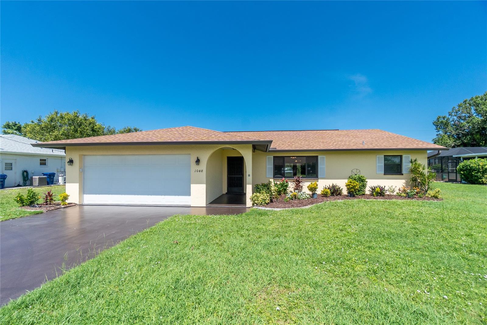 Nestled on an oversized lot of .28 acres in the coveted X Flood Zone where No flood insurance is required, this Englewood gem is a perfect blend of comfort and style. Boasting a newer roof, resurfaced heated in ground pool and a recently upgraded master bath, this charming cottage is a sanctuary for those seeking the quintessential Florida lifestyle. Step into the spacious living room, flooded with natural light from the large front window that opens up to the inviting dining room. The galley kitchen is a chef's delight, featuring brand new stainless steel appliances (2022), a double sink, and a convenient closet pantry. The pass-through window offers views of the brand new pool cage and the resurfaced (2025) sparkling in-ground heated pool, creating a seamless indoor-outdoor living experience. The free-form pool is perfect for a refreshing dip on warm Florida days, complete with a pool sweep for easy maintenance. The split floor plan offers privacy, with two en-suite bedrooms boasting walk-in closets, ideal for hosting family and friends.Enjoy a relaxing afternoon over looking the pool from the bonus room complete with 2 sliding glass doors .Located less than a 15-minute drive from the pristine Gulf beaches, you'll have easy access to sun, sand, and surf. Explore the weekly farmers market on Englewood's vibrant Dearborn Street, where you can indulge in locally grown produce and unique artisanal finds. Englewood is also home to a myriad of locally owned and operated restaurants and shops, ensuring you'll never run out of places to discover.For the outdoor enthusiast, Englewood offers county and State parks to explore, multiple boat launches and is renowned for world-class fishing opportunities. Whether you're casting a line or enjoying a sunset cruise, Lemon Bay, ICW, Boca Grande and the Gulf of Mexico await your exploration. Don't miss this opportunity to own your slice of paradise in Englewood! Call to schedule your private showing today.