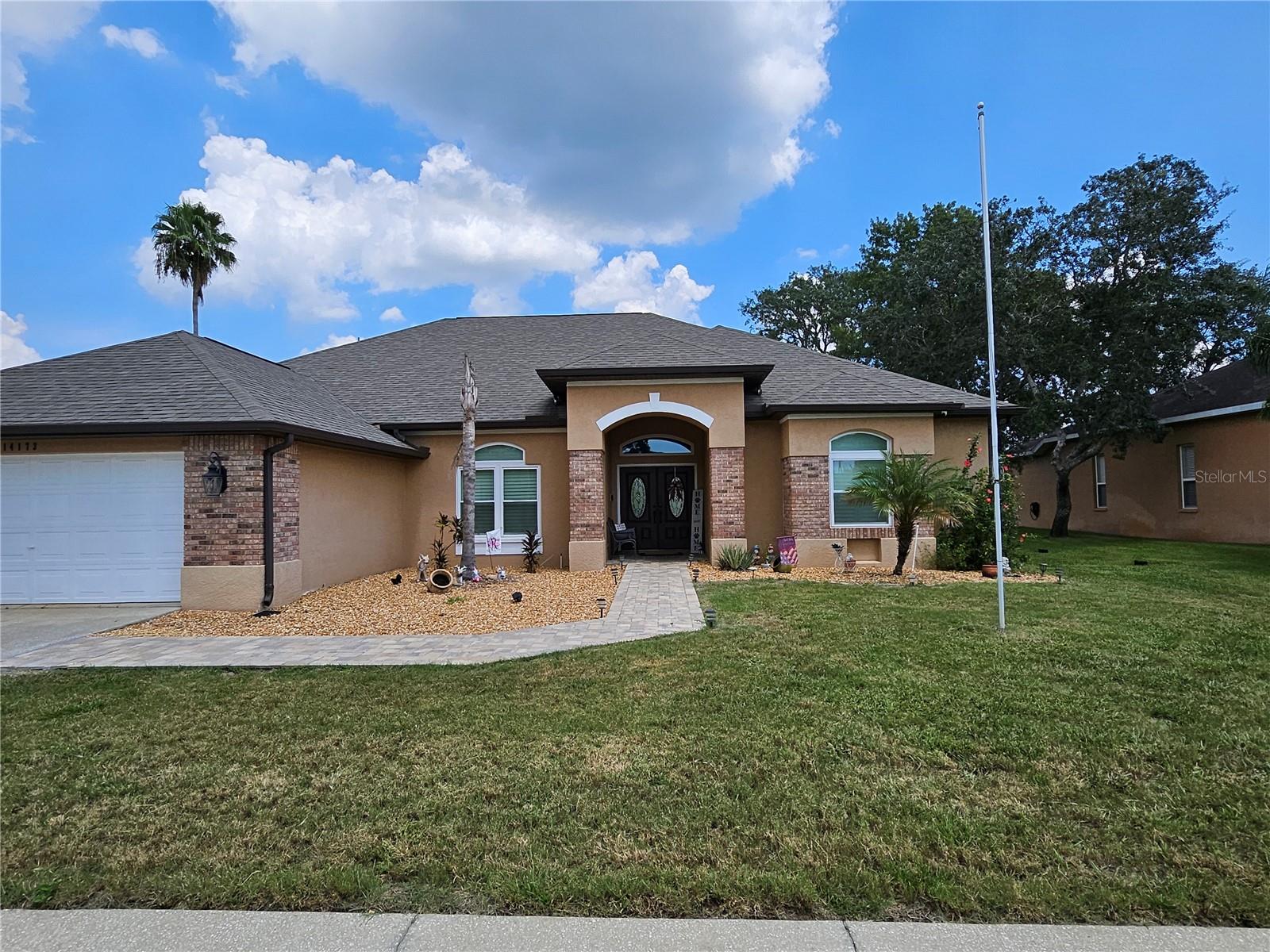 Welcome to this Gorgeous 4BR, 2.5BA, 3,200+ sqft home with modern updates in the gated Pristine Place community. Features include new double doors w/smart lock, plantation shutters (2023), formal living & dining w/built-in bar, family room w/fireplace, and a chef’s kitchen w/wood cabinets, granite, Samsung air-fryer stove, farmhouse sink, and island. The primary suite offers a jetted tub, walk-in shower, dual vanities, and 2 walk-in closets. Enjoy a wet bar w/wine fridge, 2017 roof, and new windows (2023). Outdoor living shines w/screened lanai, outdoor kitchen w/Blaze appliances & $8K Hibachi, resurfaced heated saltwater pool w/Nebula lighting, and firepit. Community amenities: clubhouse, pool, fitness, playground, tennis. Easy Suncoast Pkwy access to Tampa. Want to know more about this exceptional property? Inquire now for details.