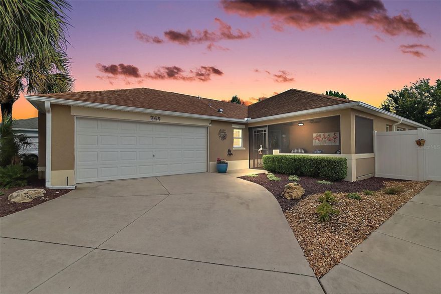 Welcome to this METICULOUSLY-MAINTAINED, BLOCK and STUCCO 3-bedroom, 2-bath Avondale courtyard villa where MODERN ELEGANCE meets OUTDOOR SERENITY! This INCREDIBLE home boasts a TWO-CAR GARAGE (rare in a villa), SCREENED LANAI, and FABULOUS 40’x21’ PATIO with PERGOLA and LOW-MAINTENANCE, STONED front, side, and rear yards - NO GRASS - perfectly situated on a LARGE, PRIVATE, CORNER LOT with ROOM FOR A POOL in the Village of Pine Ridge! A QUAINT SCREENED front porch with EPOXY PEBBLE floor and BEAUTIFUL LEADED GLASS door and side light welcome you in to the bright, generous foyer with LUXURY VINYL PLANK flooring running seamlessly throughout the ENTIRE home. ADDITIONAL UPGRADES include PLANTATION SHUTTERS, CUSTOM CORNICES, EXTENDED BASEBOARDS, MODERN LIGHTING and FANS, and a BRAND NEW WHOLE-HOUSE GENERAC! The OPEN CONCEPT floor plan and HIGH VAULTED ceilings of the living, dining, and kitchen create a SPACIOUS main area - perfect for entertaining friends and family! The AMAZING kitchen showcases GORGEOUS NATURAL LINEN cabinetry, GRANITE countertops, TILE backsplash, STAINLESS STEEL appliances, BUILT-IN PANTRY with ROLL-OUT SHELVING, and an EBONY CENTER ISLAND with EAT-IN area. The adjacent dining and living rooms feature multiple windows and two sets of sliding glass doors for an ABUNDANCE of NATURAL LIGHT. From either of these rooms, enter into the SCREENED LANAI with EPOXY PEBBLED floor and ceiling fan. This wonderful room opens to the PRIVATE, FULLY-ENCLOSED rear and side courtyards featuring an EXPANSIVE PATIO with ELEGANTLY DESIGNED PERGOLA. This FANTASTIC outdoor area boasts enough ROOM FOR A POOL and offers a TRANQUIL, PRIVATE space for outdoor dining, entertaining, or simply relaxing and enjoying the BEAUTIFUL Florida weather! Back inside, retreat to the primary bedroom showcasing a TRAY ceiling, CUSTOM WALK-IN closet, and DOUBLE windows. Its en-suite bathroom features CINNAMON cabinetry, DUAL sinks, TILED ROMAN-STYLE WALK-IN shower, and a separate water closet. Bedroom two features a VAULTED ceiling and built-in closet while the updated second bathroom boasts a contemporary BARN DOOR entry, NATURAL LINEN vanity, TILED WALK-IN shower with FRAMELESS glass, and a hall LINEN closet. The third bedroom with a large window, SOLAR TUBE and built-in closet showcases CUSTOM, BUILT-IN, WHITE cabinetry with DESK, SHELVING, and MURPHY BED. This VERSATILE ROOM offers the ideal space for a home office, craft room, den, and/or additional sleeping area. Completing the package is a 23’x19’ TWO CAR GARAGE with EPOXIED floor, convenient laundry nook, white cabinetry, utility sink, suspended storage shelving, and attic access with stairs. DON’T MISS YOUR OPPORTUNITY TO MAKE THIS INCREDIBLE HOME YOUR OWN! The Village of Pine Ridge is IDEALLY LOCATED near both Lake Sumter Landing and Brownwood Paddock Squares. Close to Belle Glade Country Club and Championship Golf Course; Colony Cottage Regional Recreation Center; Sarasota Golf Practice Facility; Sharon Rose Wiechens Nature Walk and Preserve; Atlas Dog Park; and Colony Plaza and CR 466A with an abundance of shopping, dining, banking, medical, and more! PLEASE WATCH OUR WALKTHROUGH VIDEO of this FABULOUS HOME IN AN AMAZING LOCATION and call today to schedule your Private Showing or Virtual Tour!